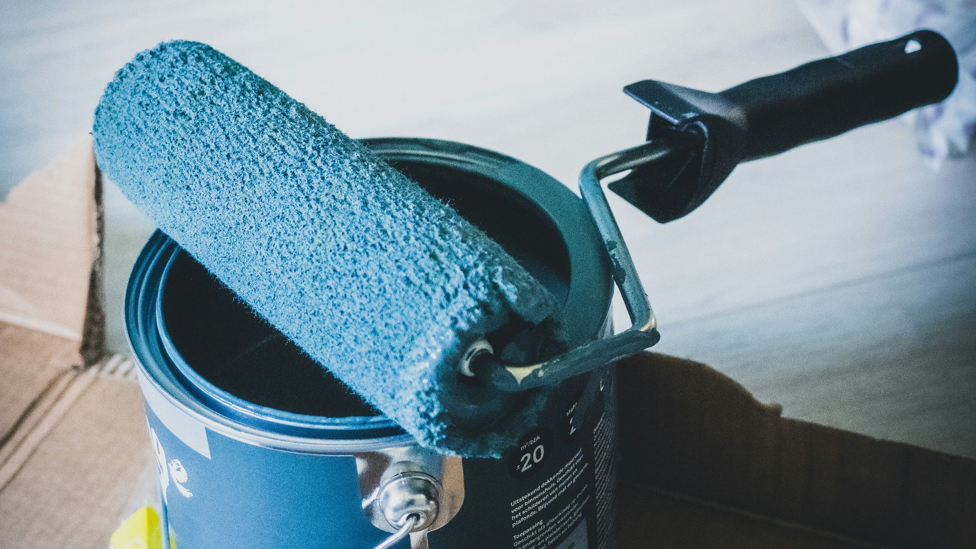 blue and white can on white table
