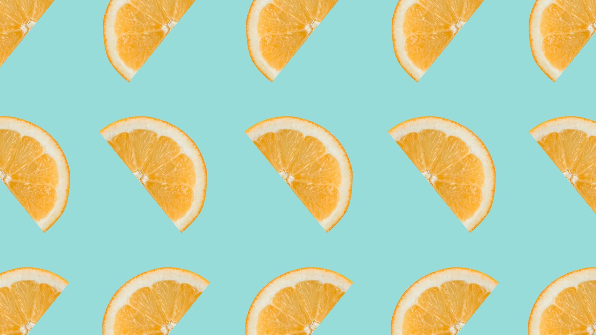 sliced orange fruits on white background