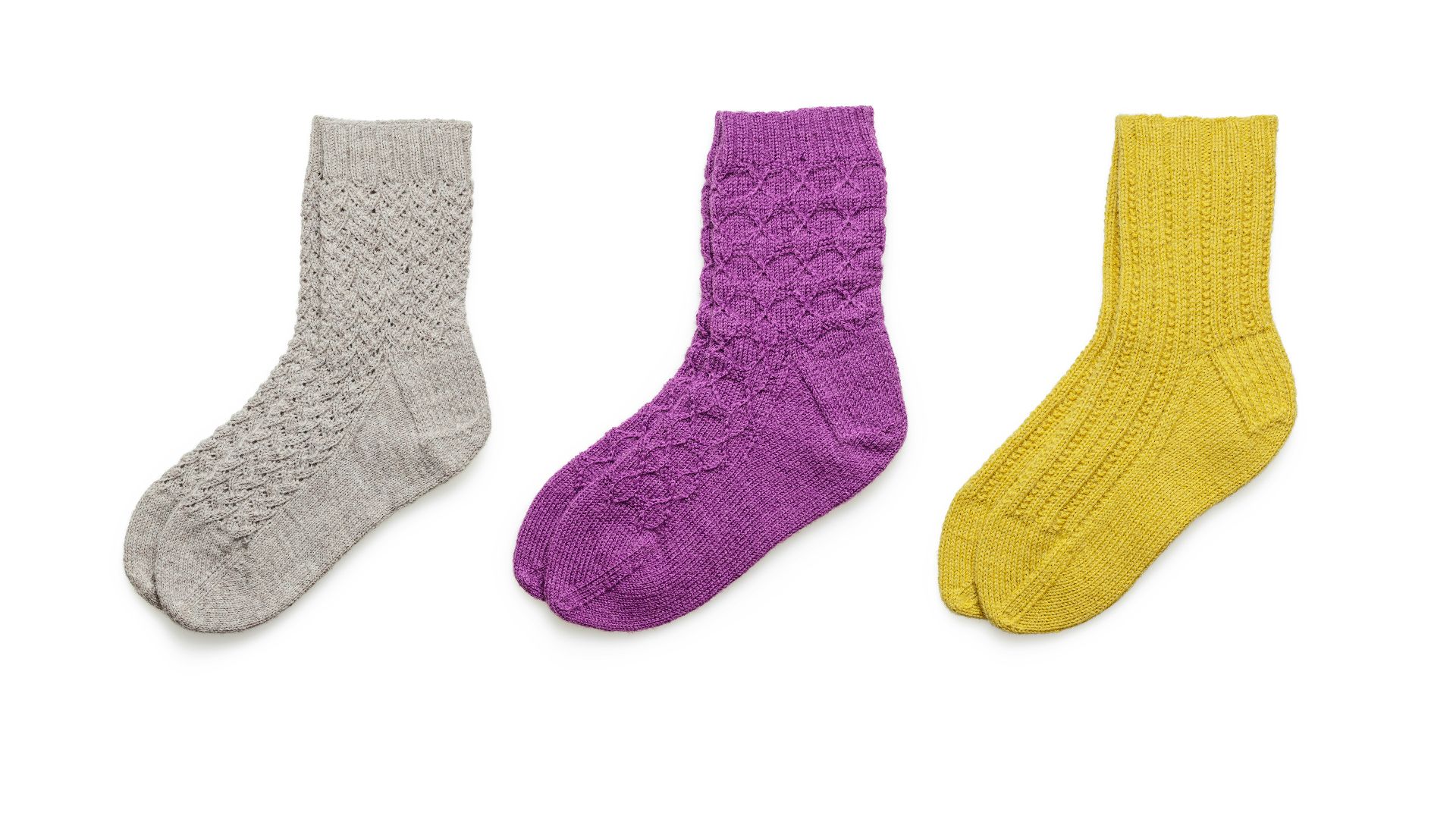 blue and black socks on white background