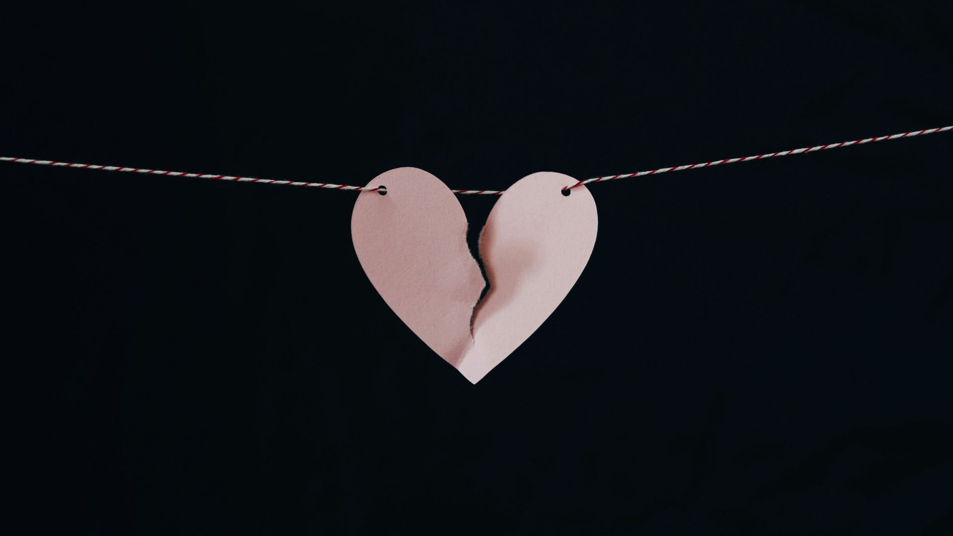 broken heart hanging on wire