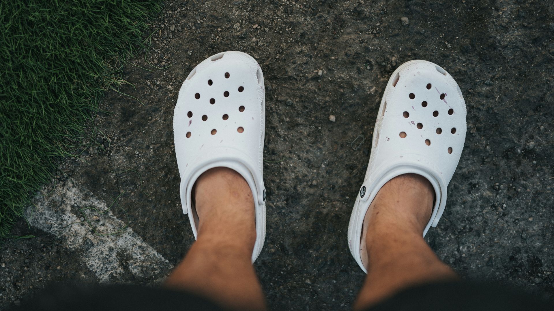 person wearing white rubber clog