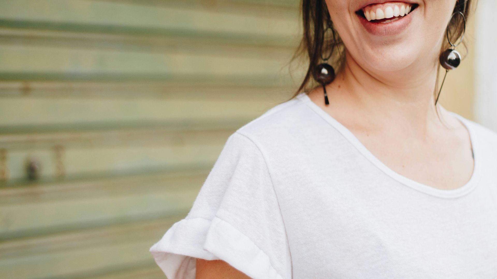 woman standing in front of rolling shutter