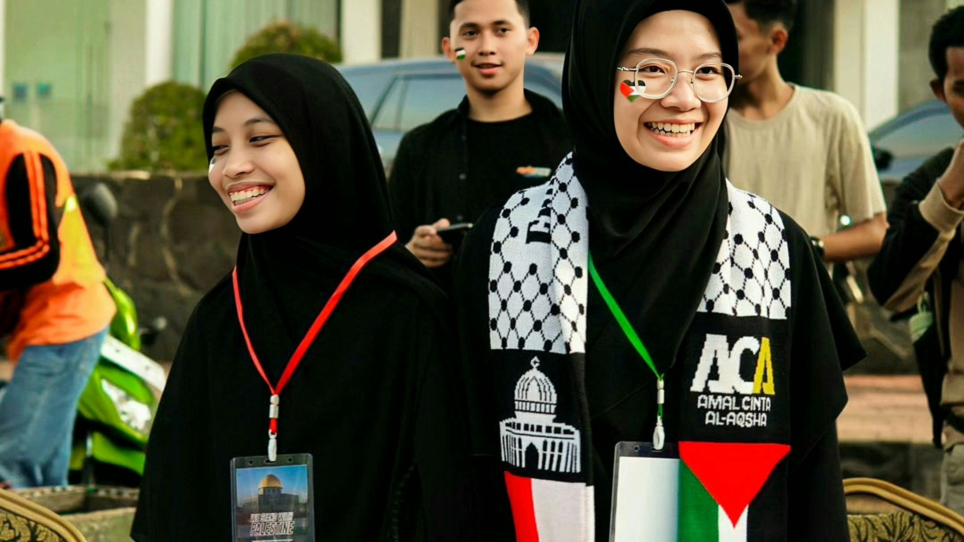 a group of people standing around a table with hats on it