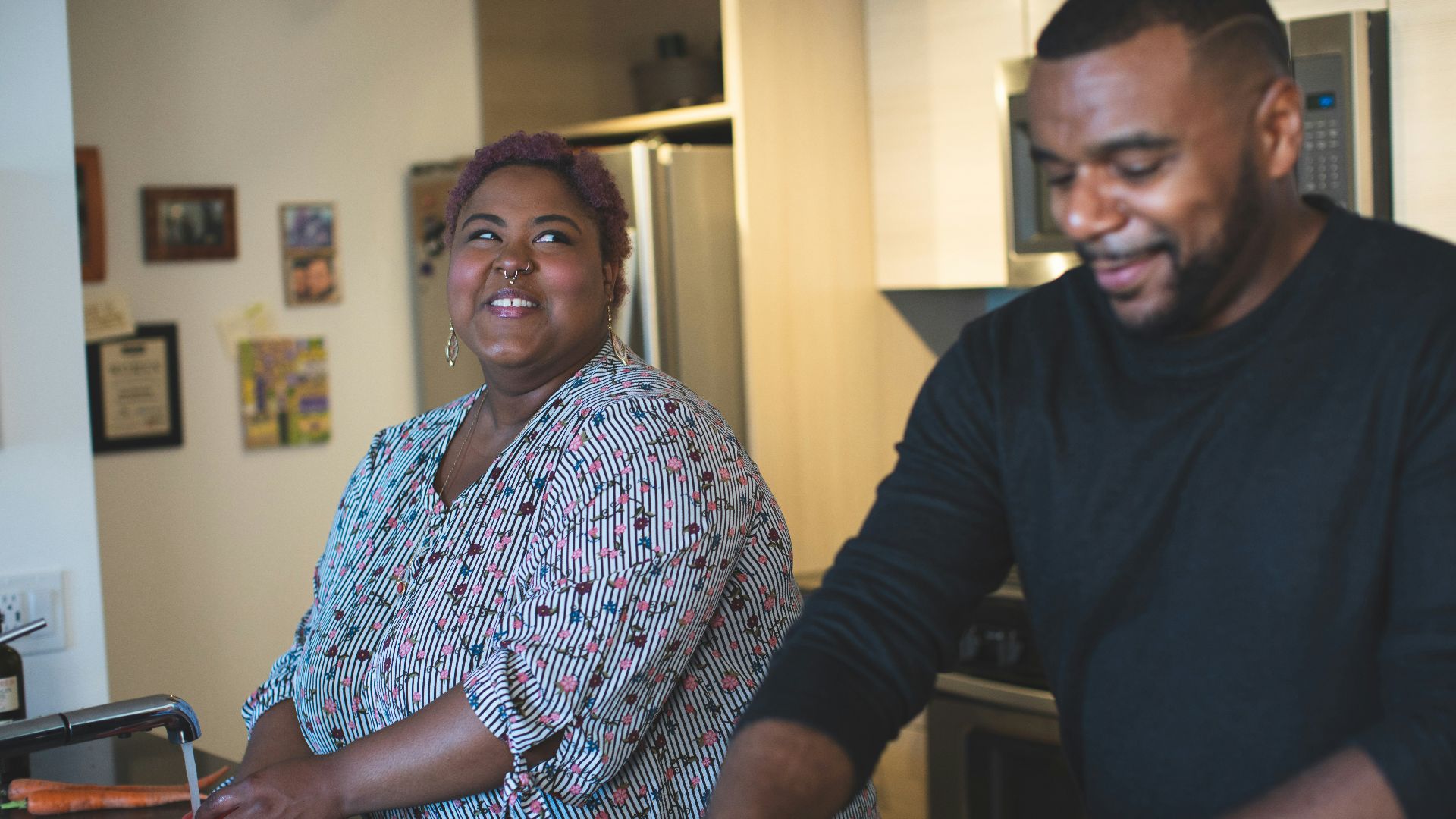 man and woman standing near wall