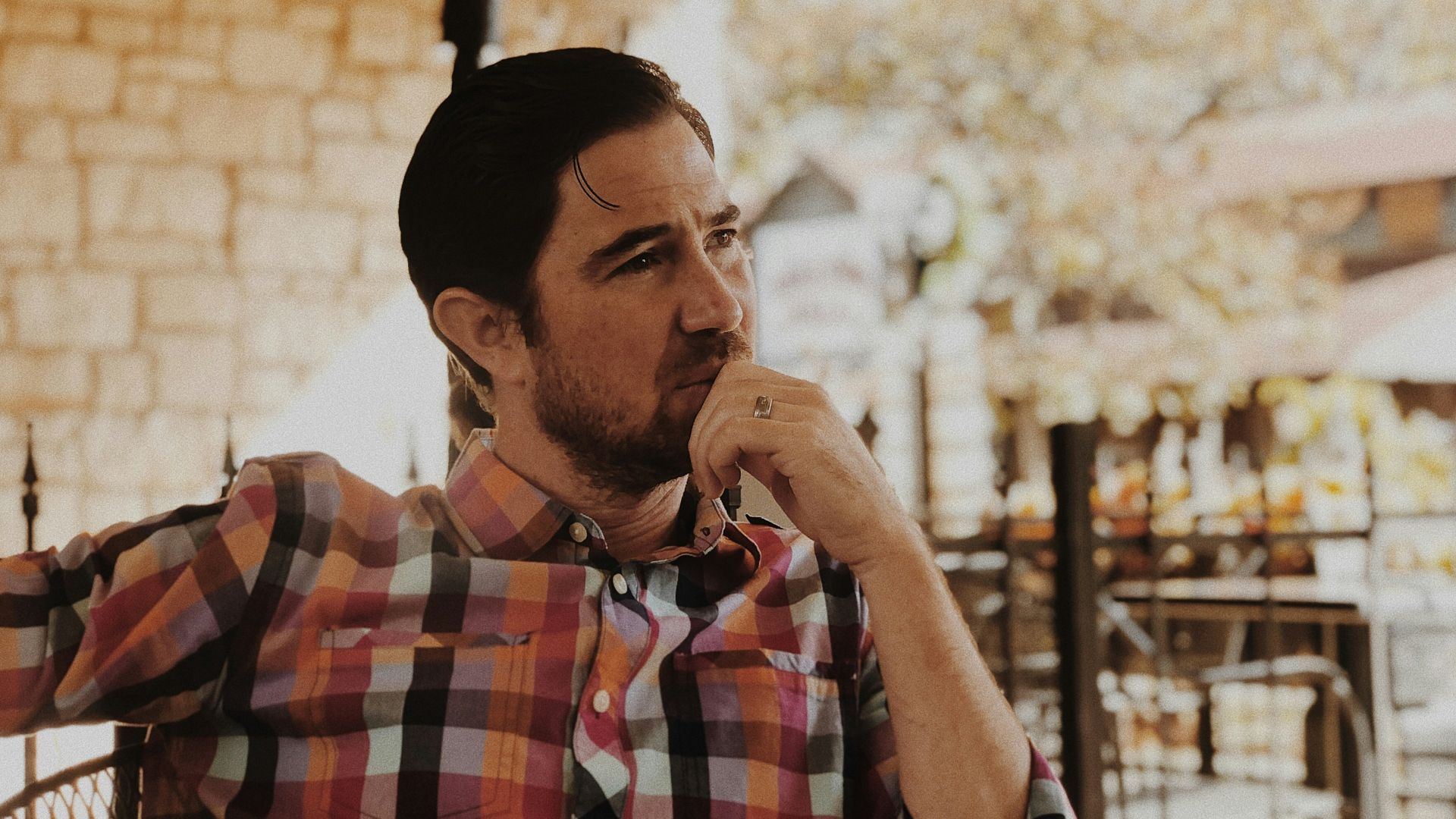 man in red and black plaid dress shirt