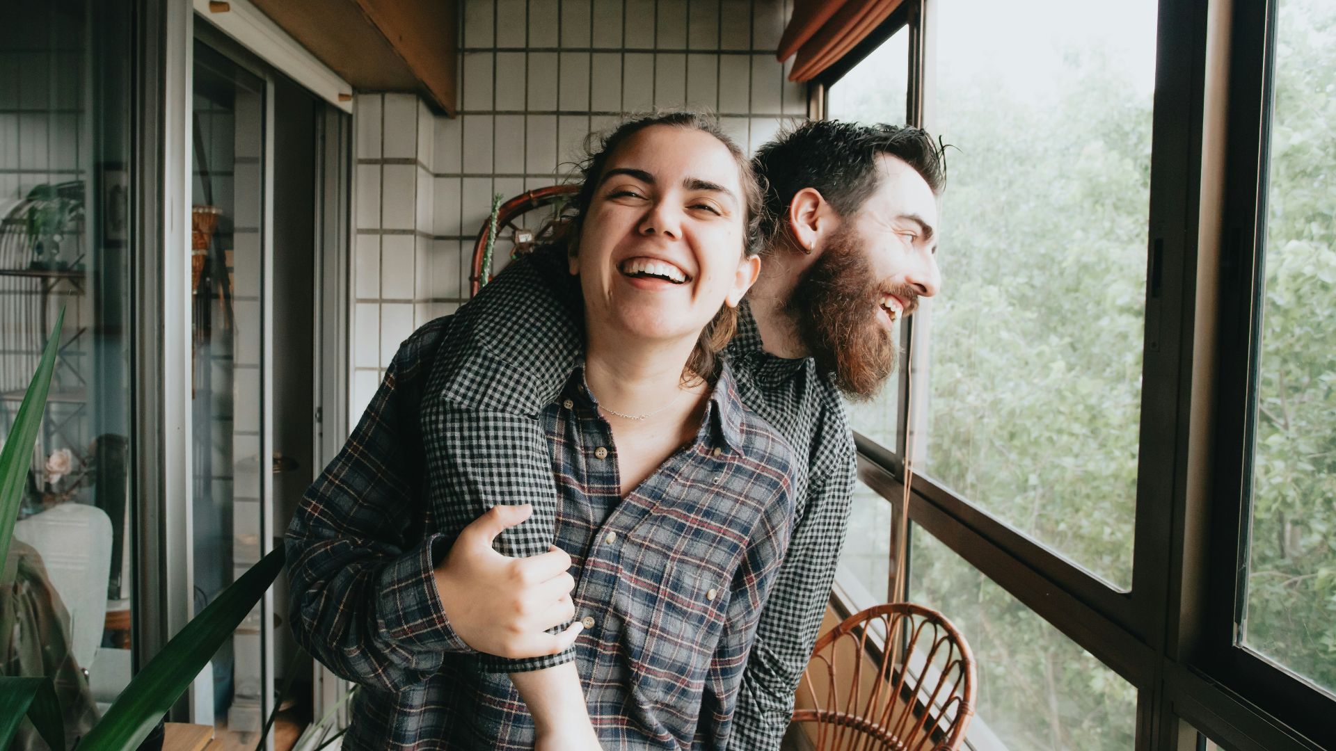 man and woman sitting on chair