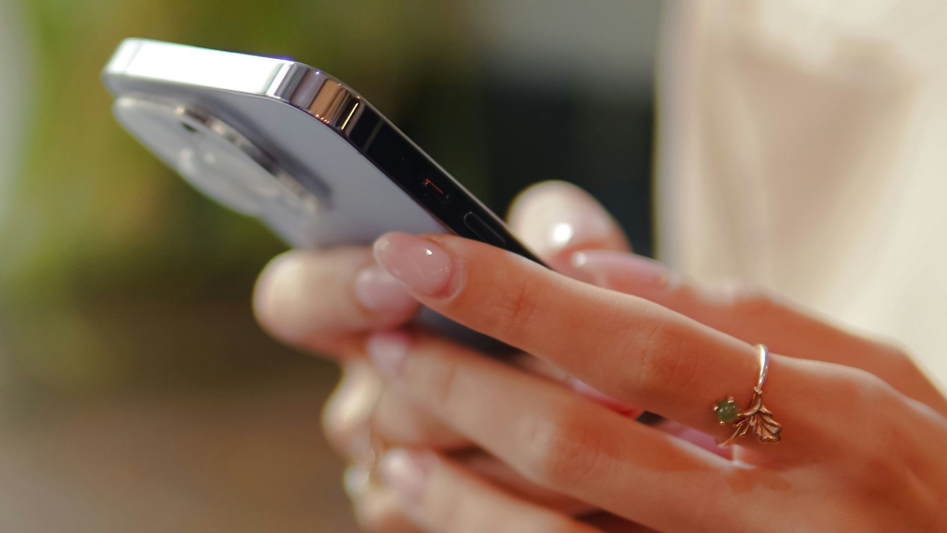 a close up of a person holding a cell phone