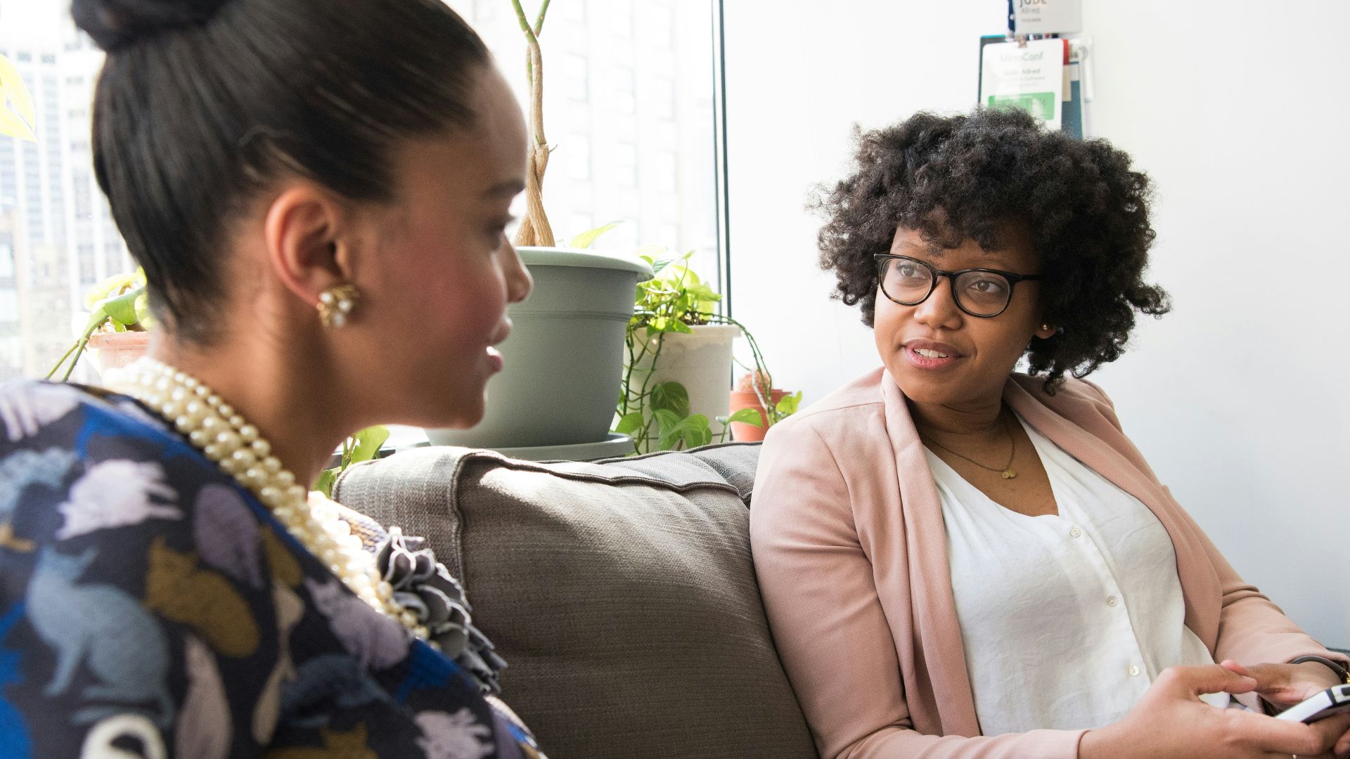 shallow focus photo of woman in beige open cardigan