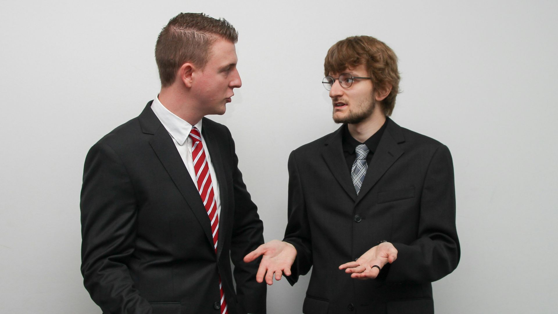 man wearing black suit jacket