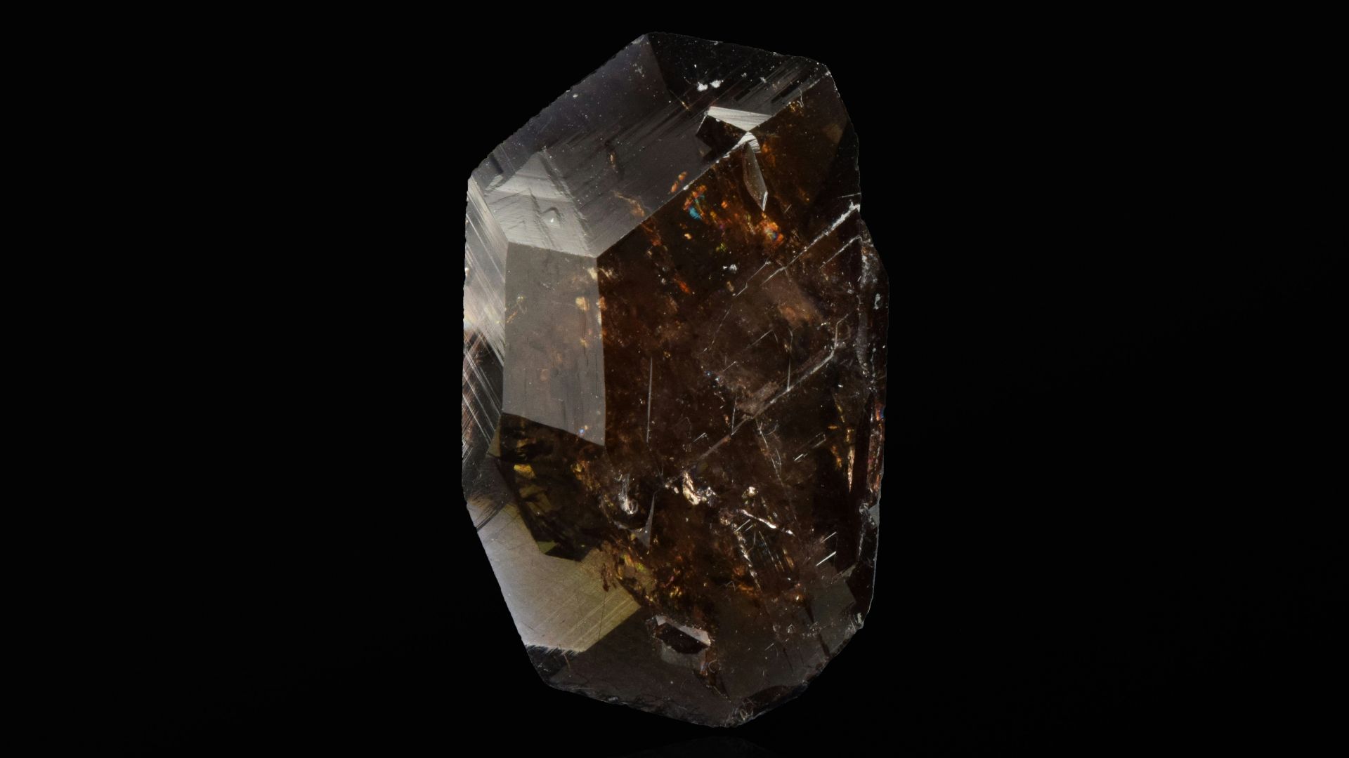 clear crystal stone on black surface