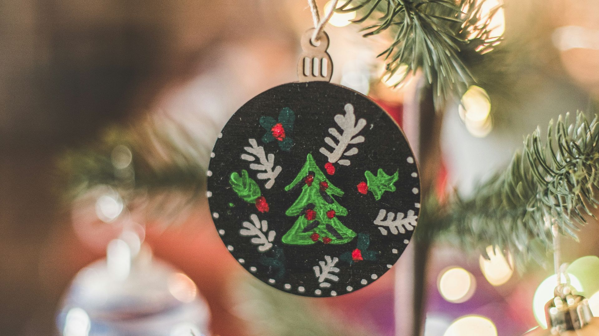 a decorated tree with a sign