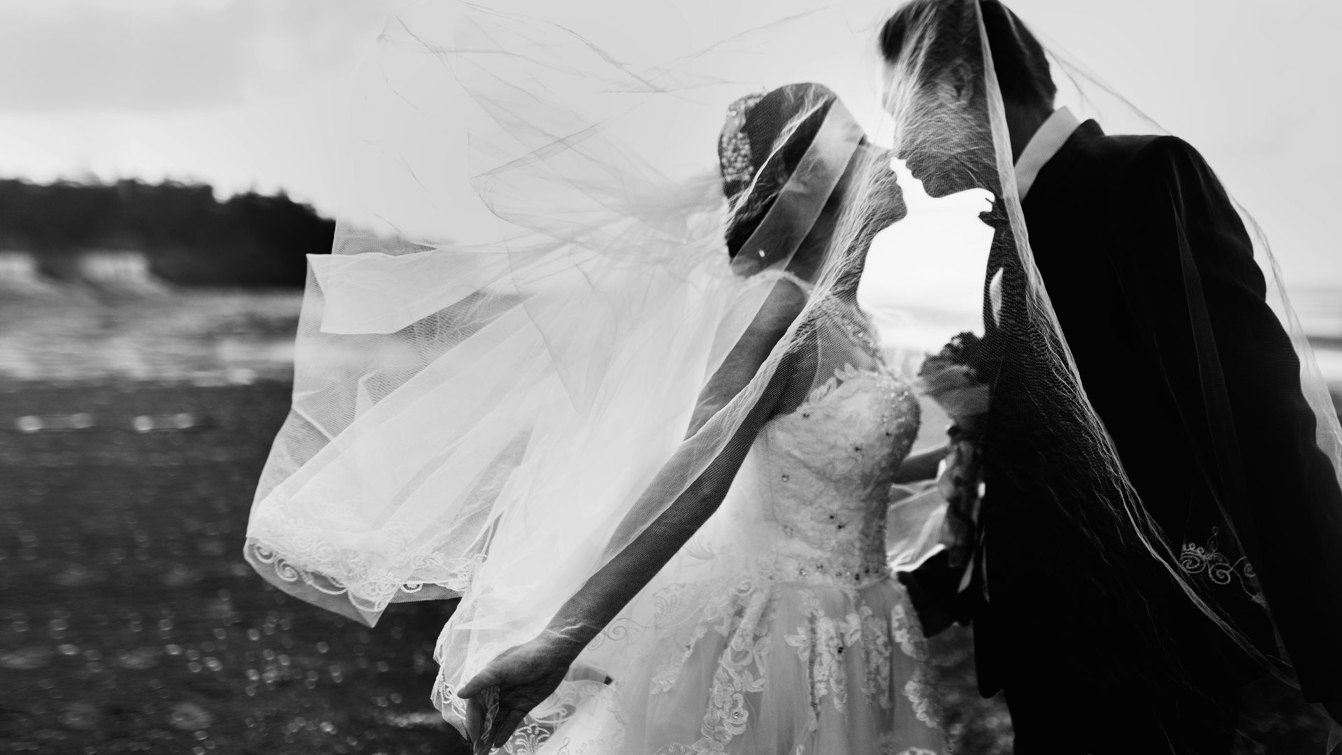 grayscale shot of bride and groom