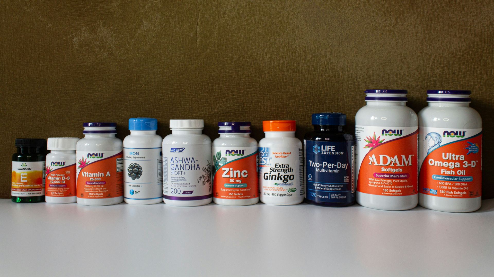 a row of bottles of different types of vitamins