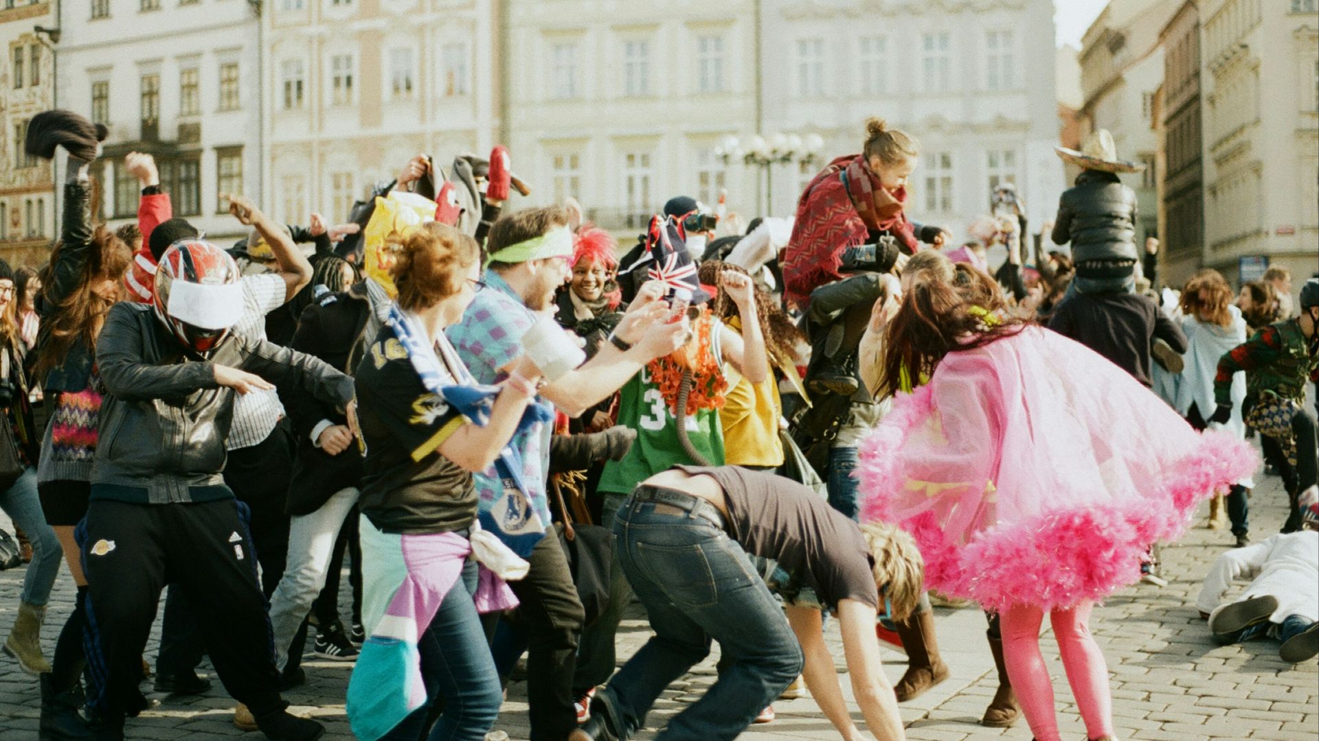 a group of people dancing in the street