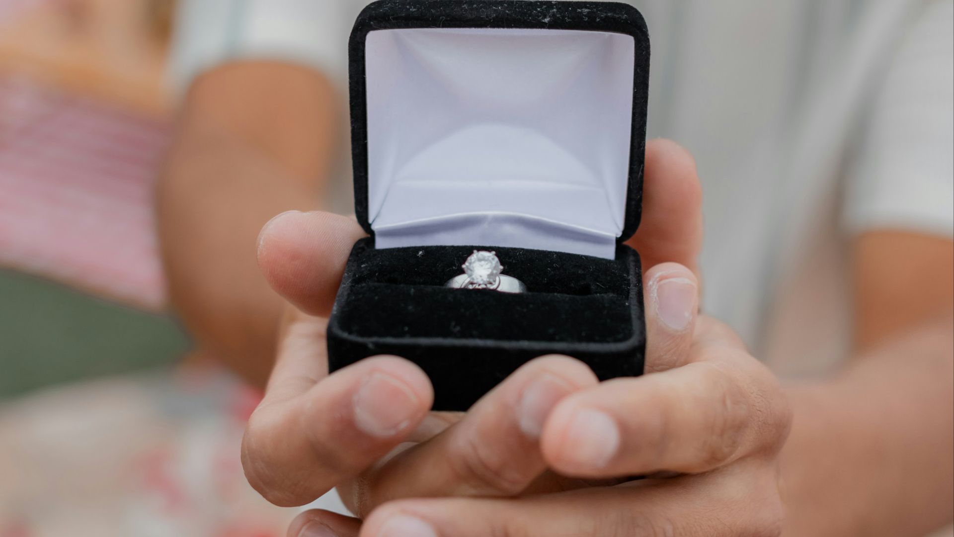 A man holding a ring in his hand