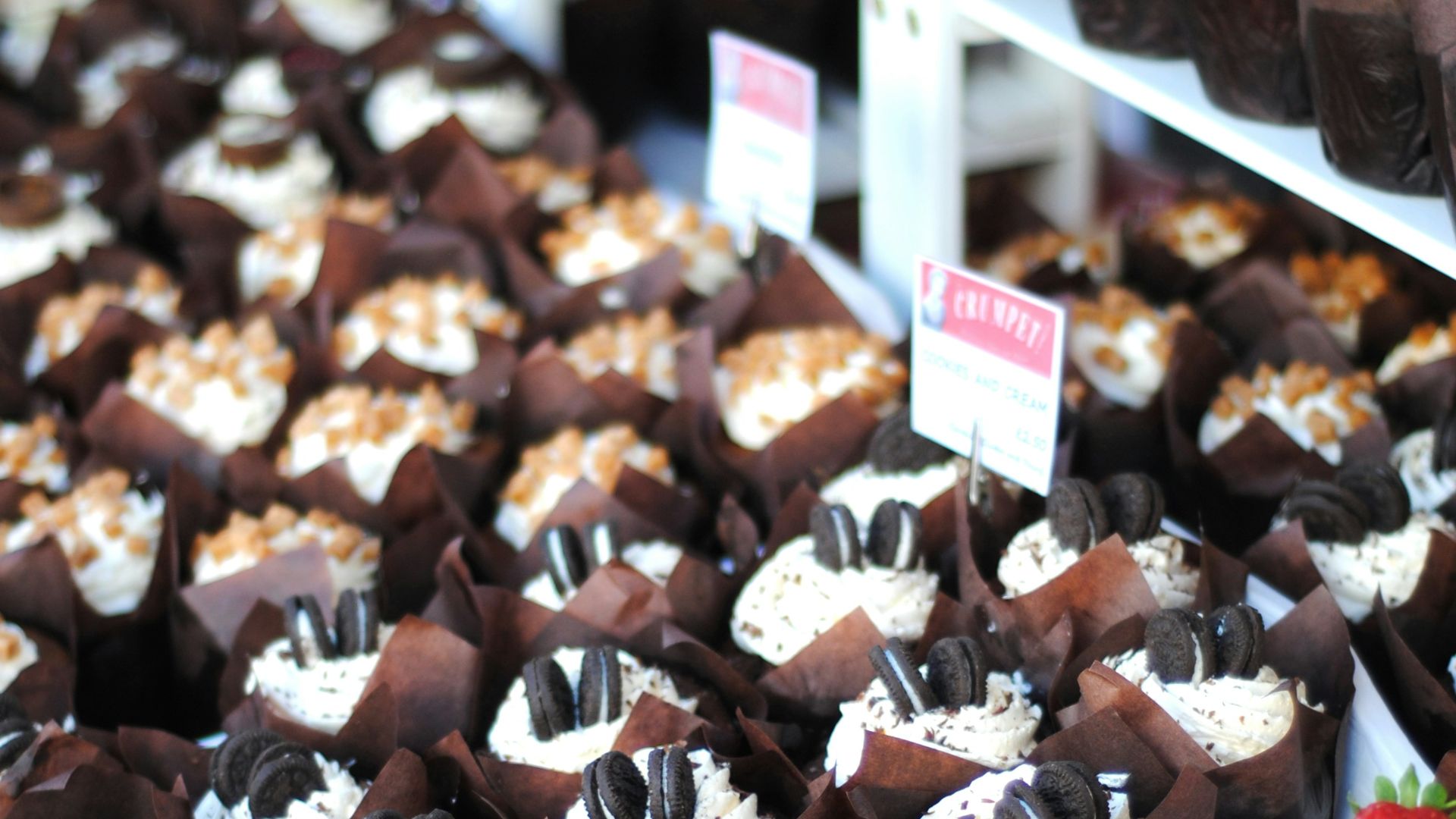 chocolate cupcakes with strawberries and cookies