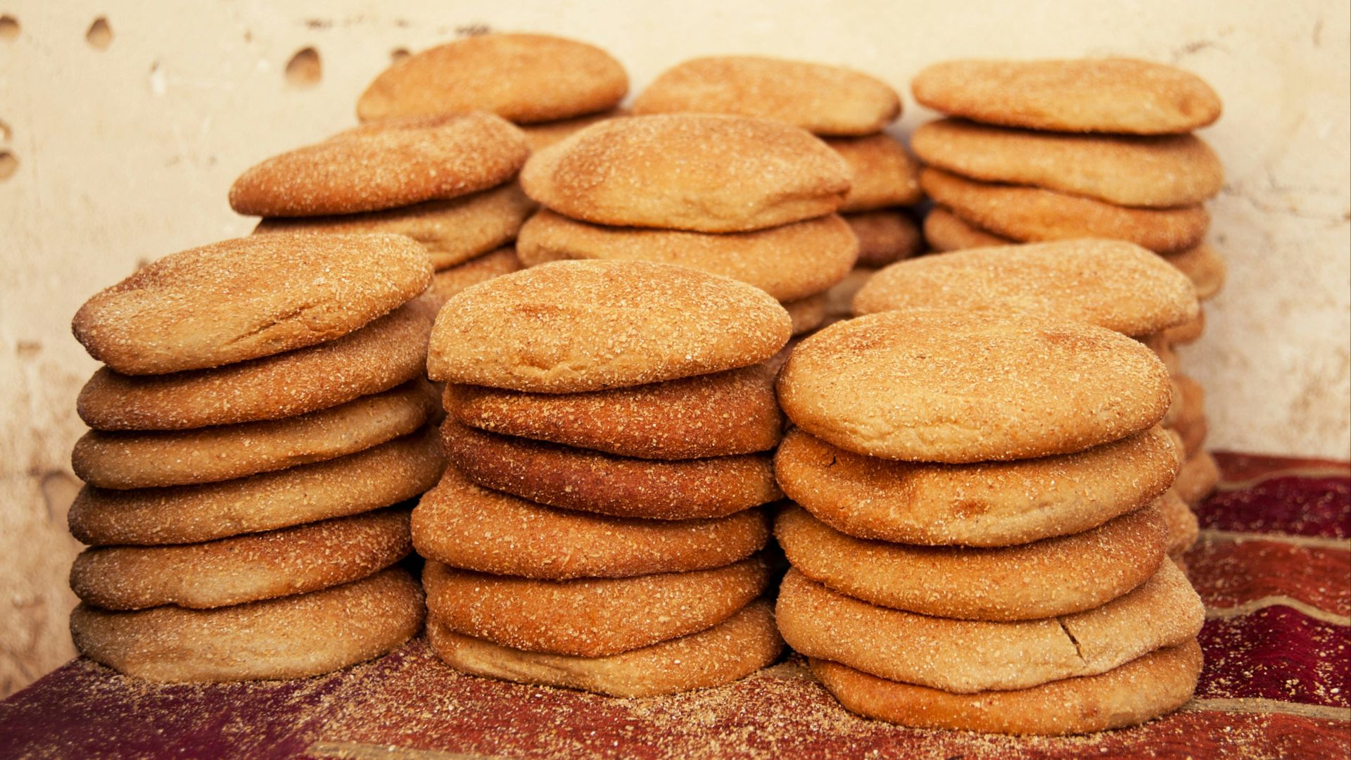 a stack of cookies sitting on top of a red rug