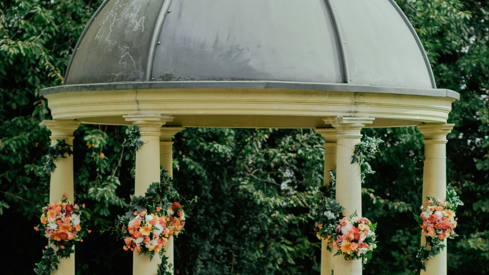 gray and beige gazebo near green leafed tree