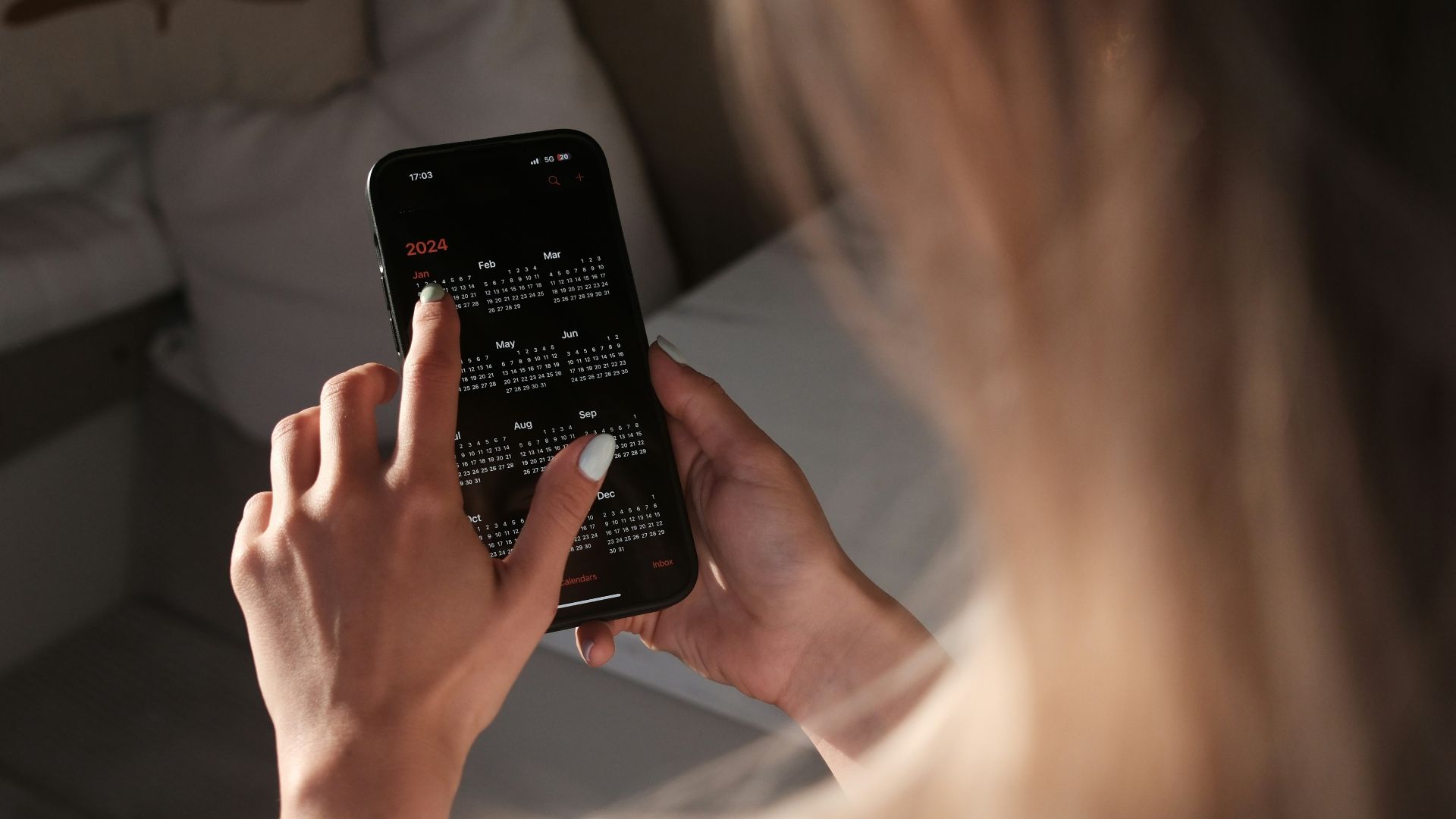 a woman holding a cell phone up to her face