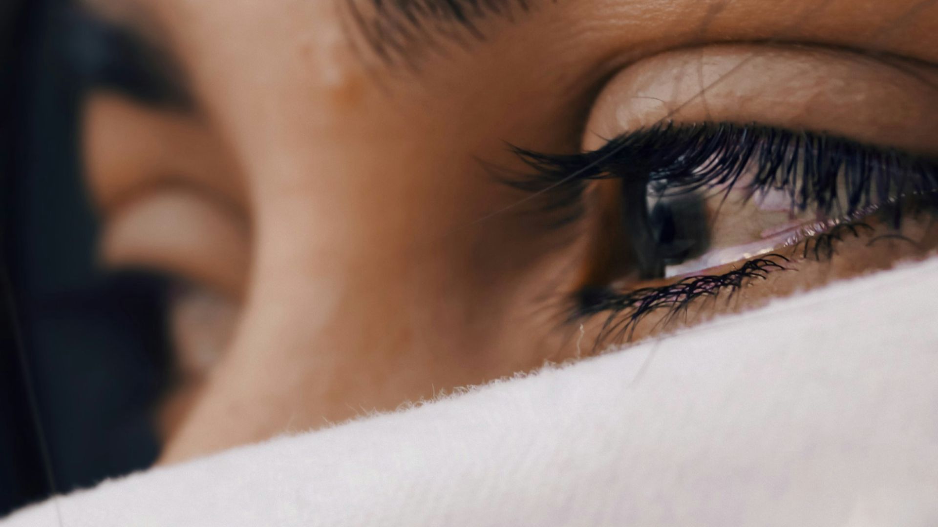 shallow focus of a woman's sad eyes