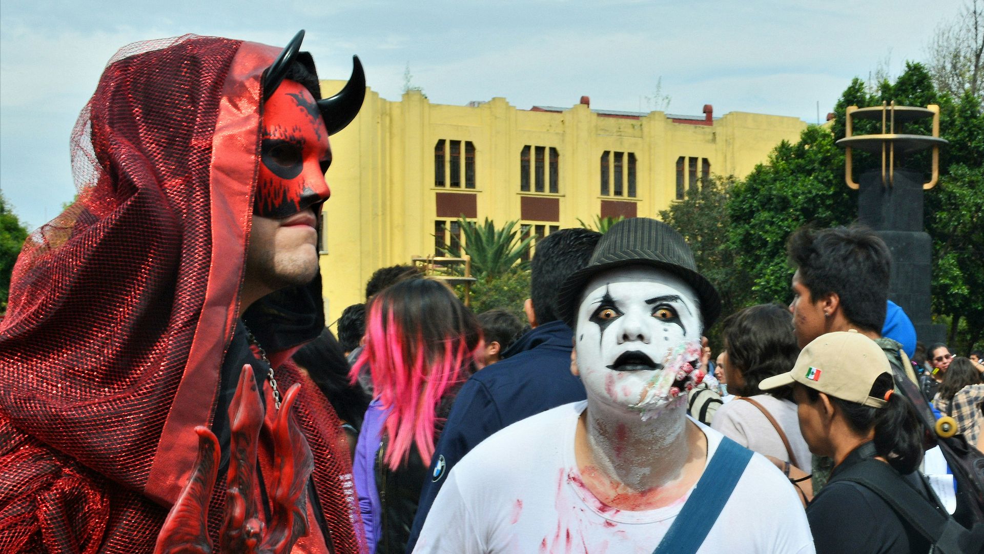 man in white crew neck shirt with red and white face paint