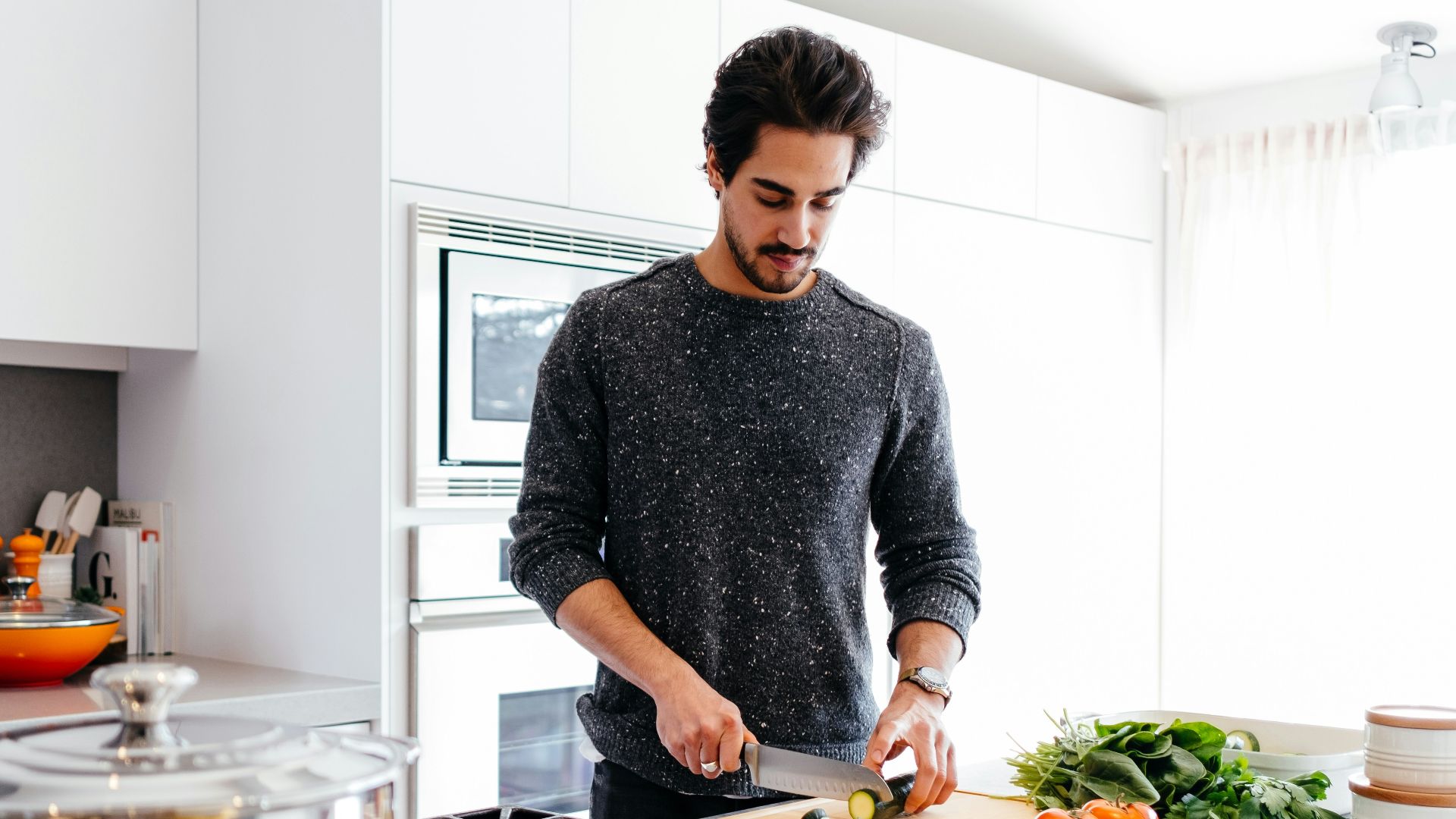 man cutting vegetables