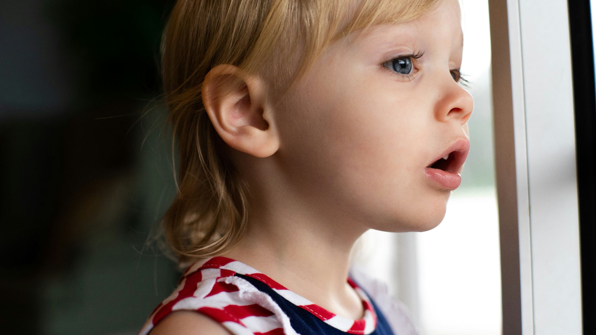 girl in blue and white tank top