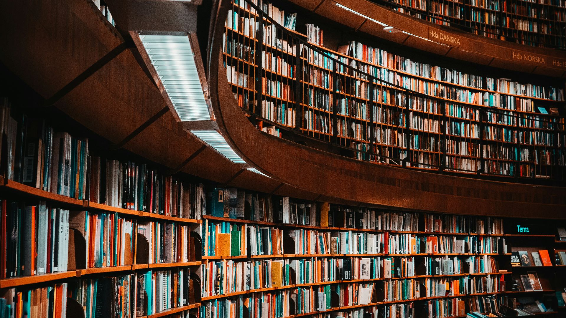 photo of brown wooden bookshelf