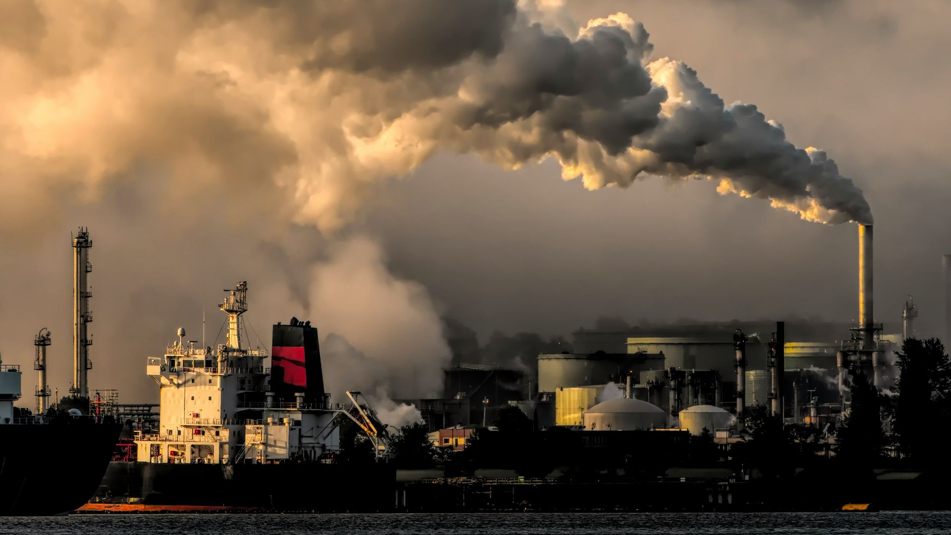 white and black ship on sea under white clouds