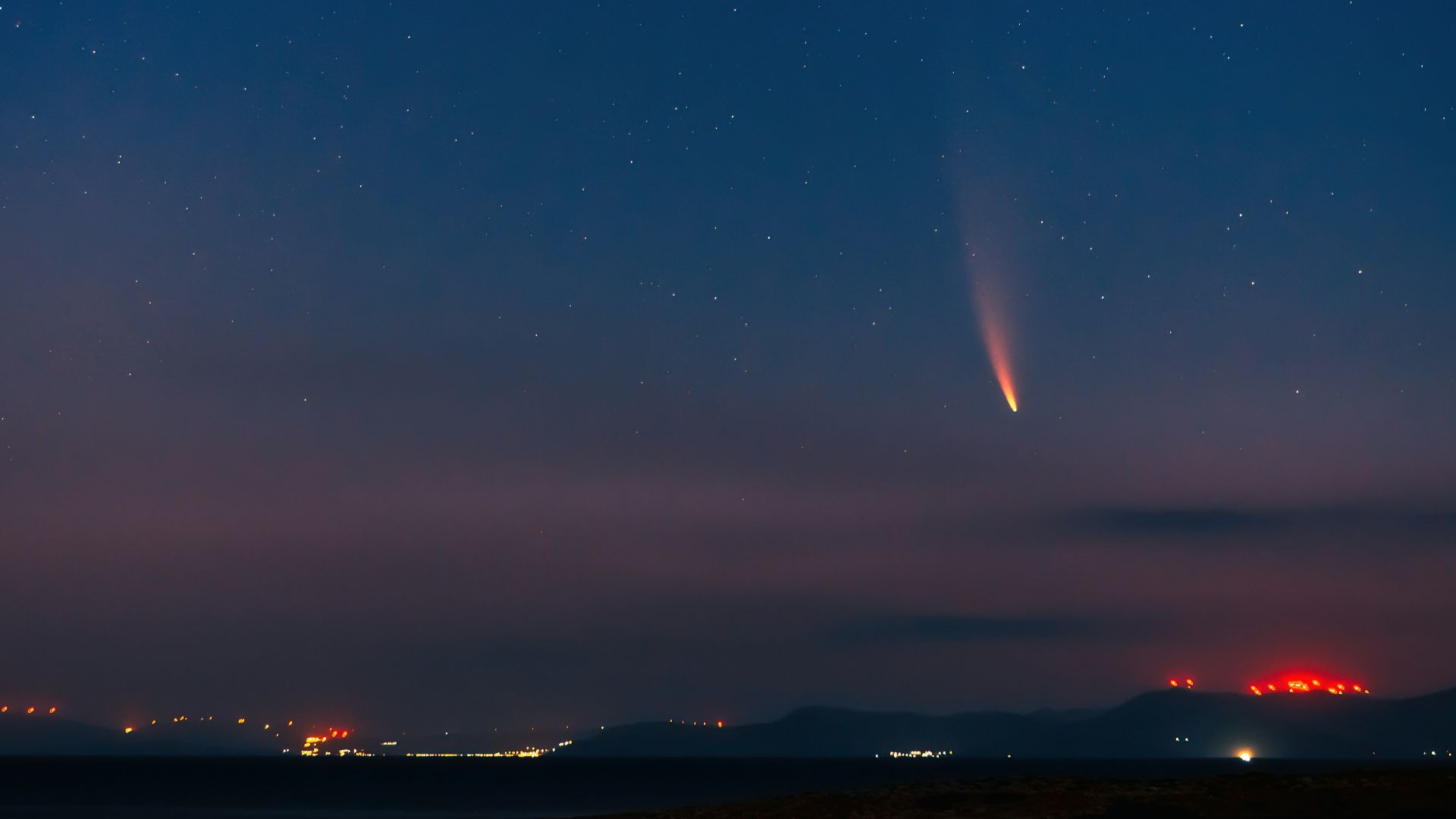body of water under blue sky during night time