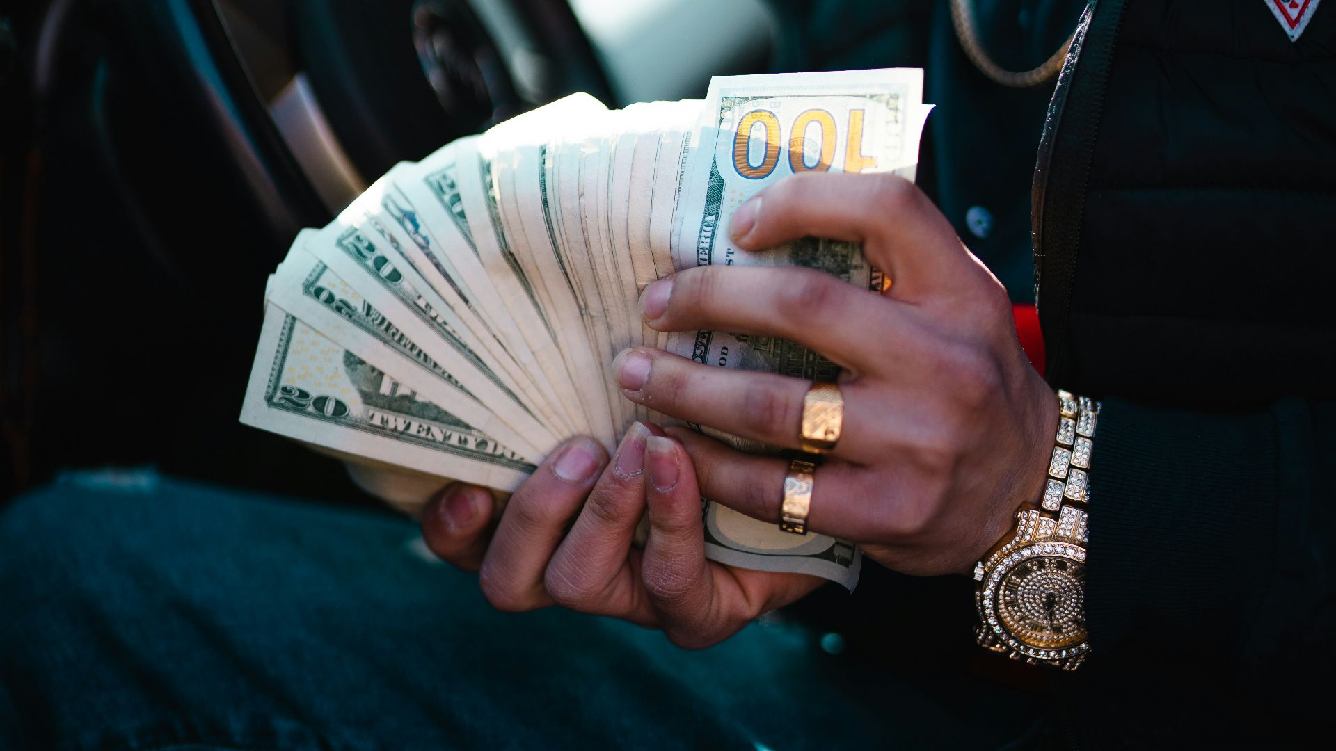 man in blue dress shirt holding white ceramic mug