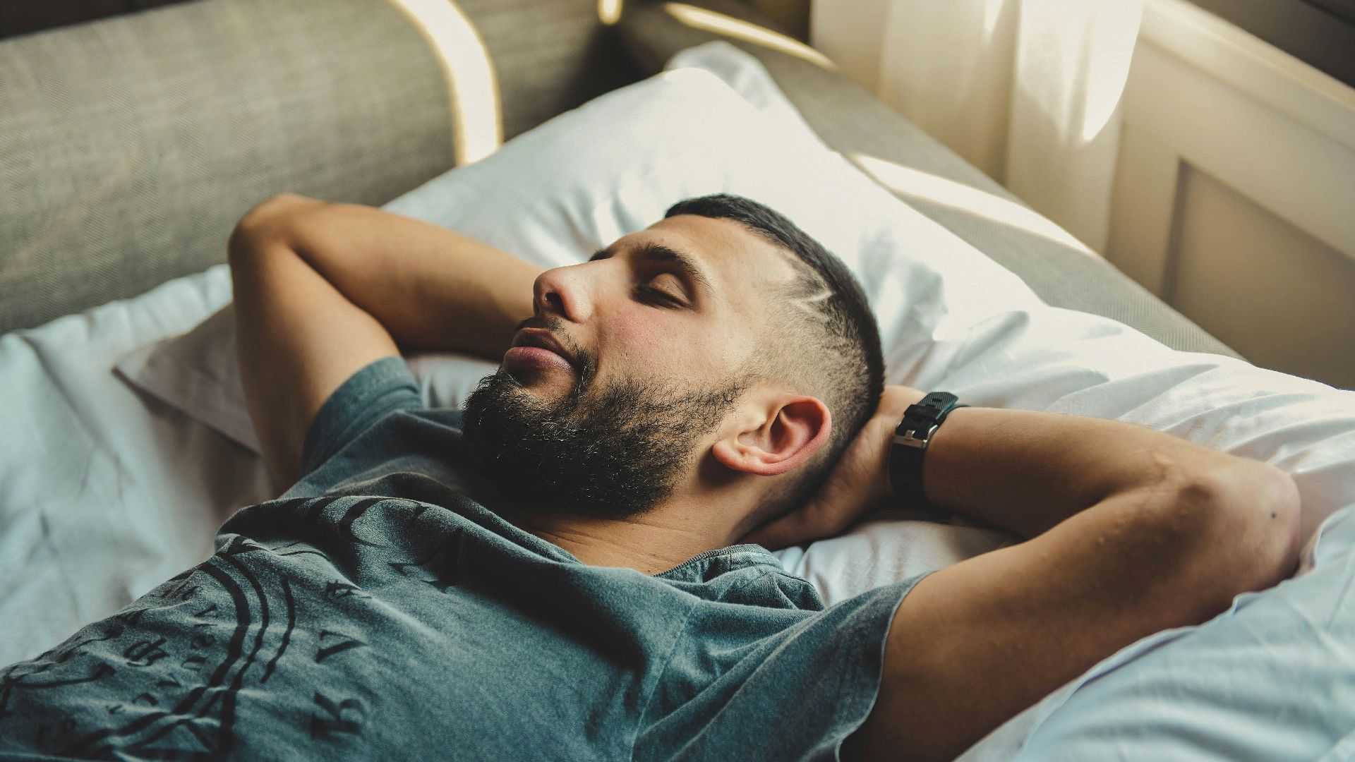 man lying on bed