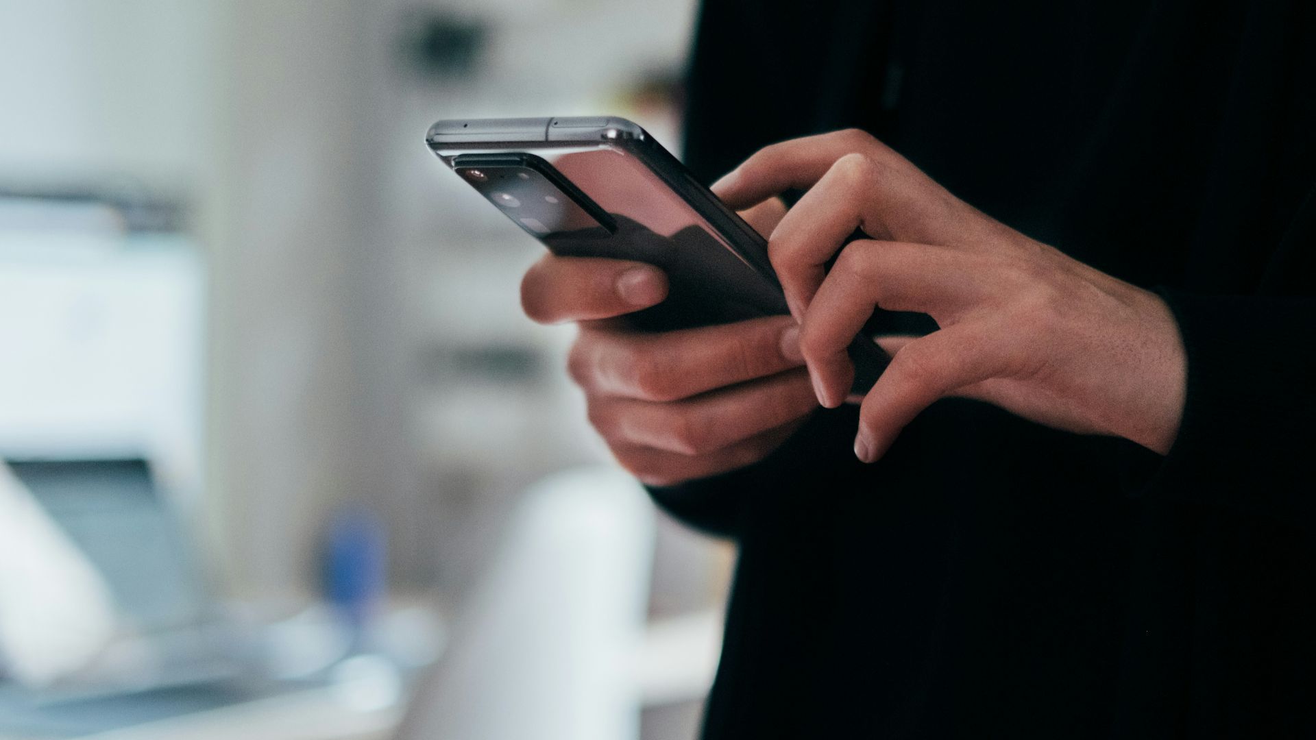 person holding black android smartphone