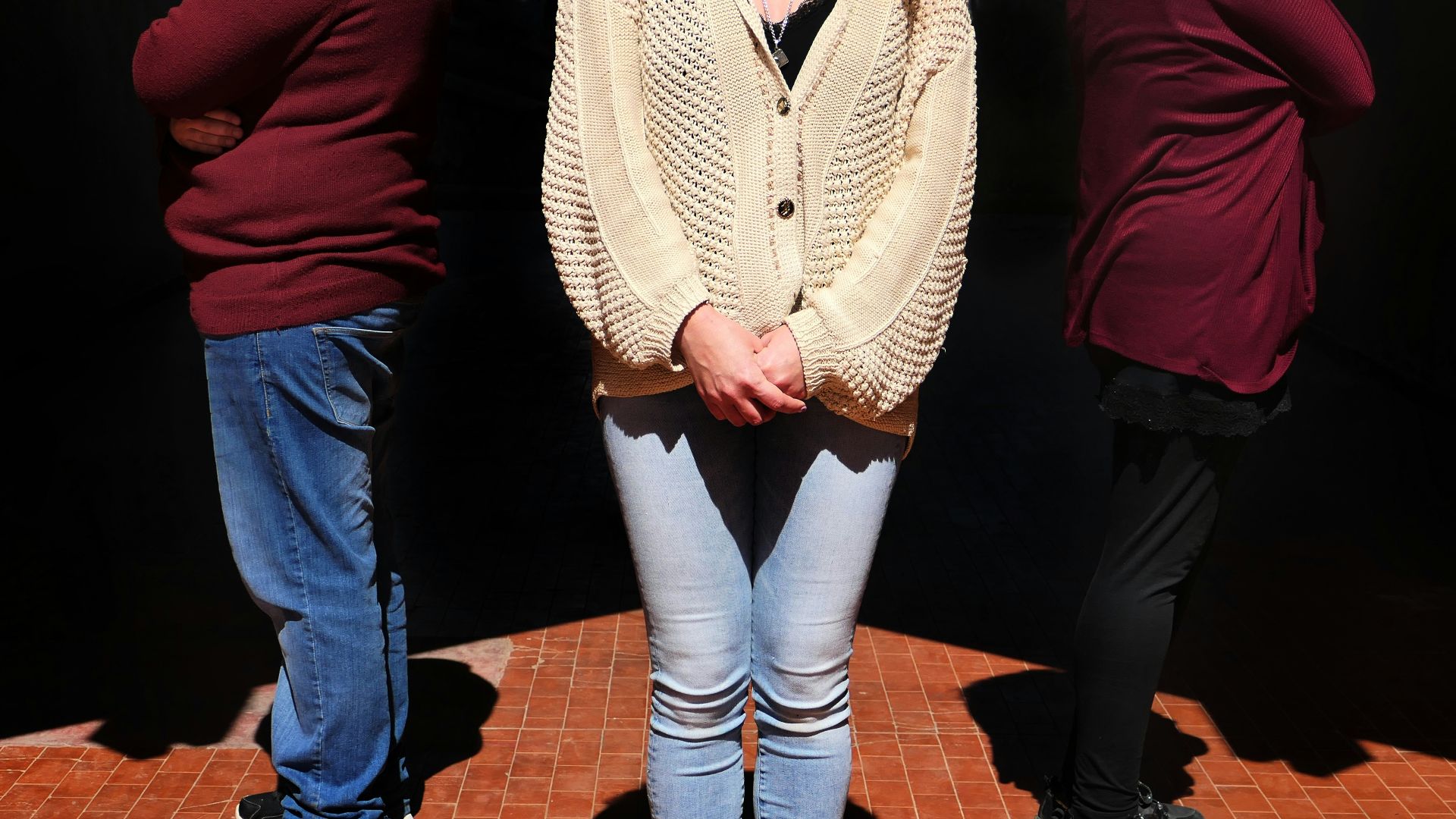 a person wearing a jacket and jeans