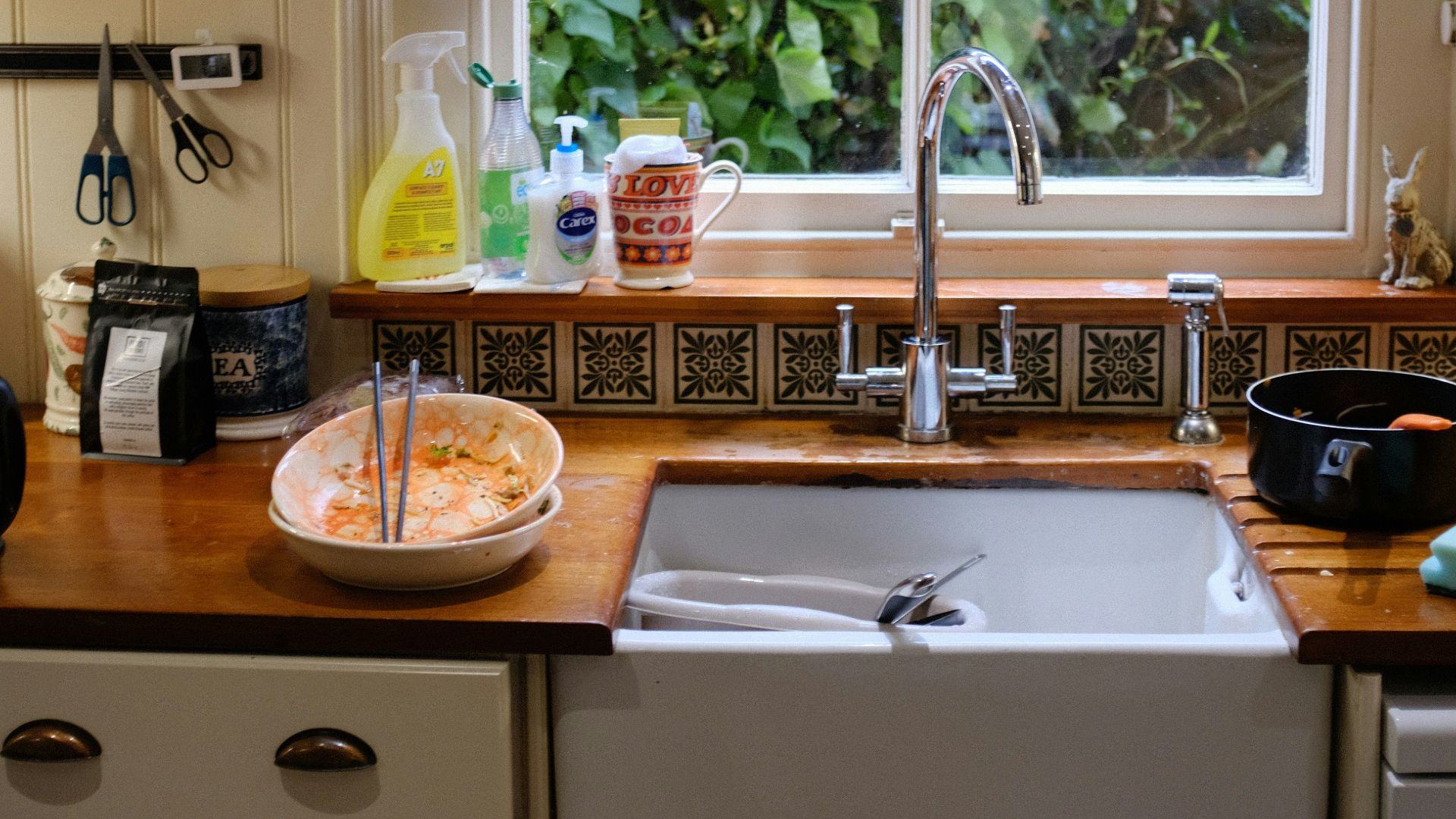 brown wooden round table with stainless steel faucet