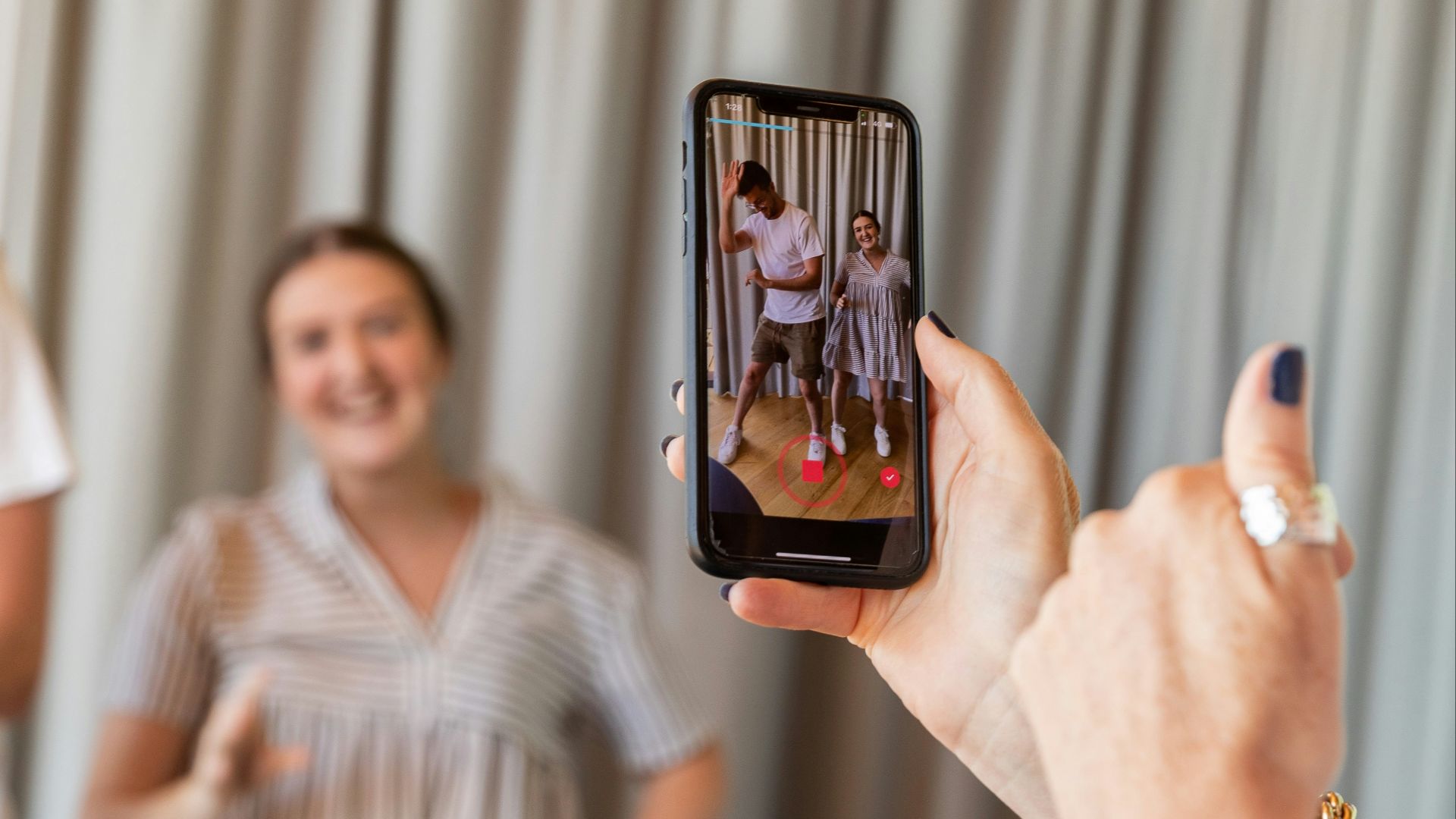 a woman holding a picture of a man