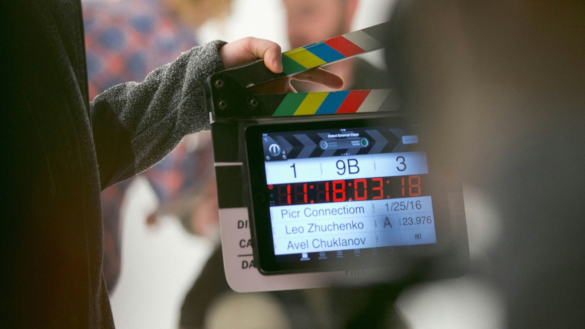 person holding clapperboard