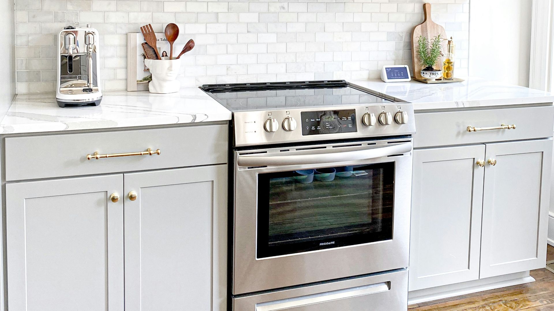 white microwave oven on white wooden cabinet