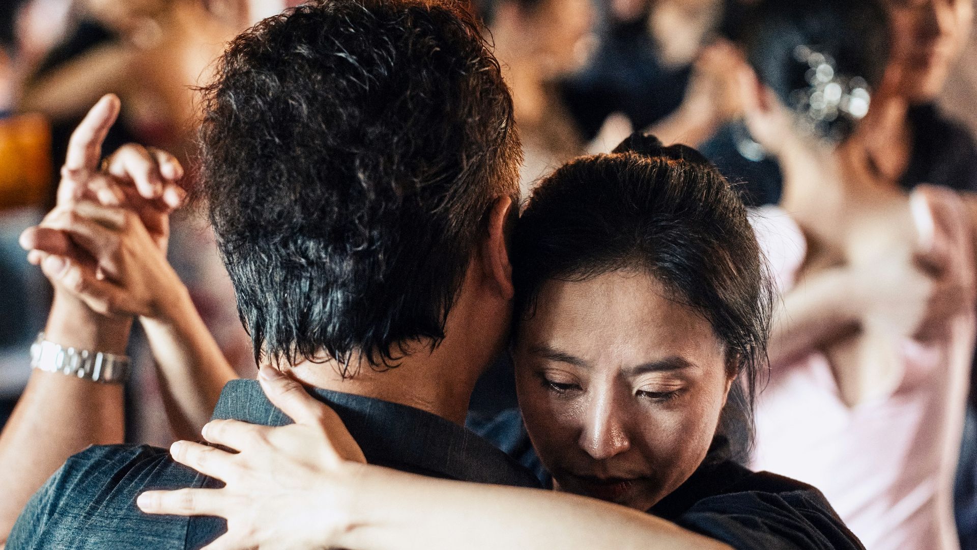 a couple of people that are hugging each other