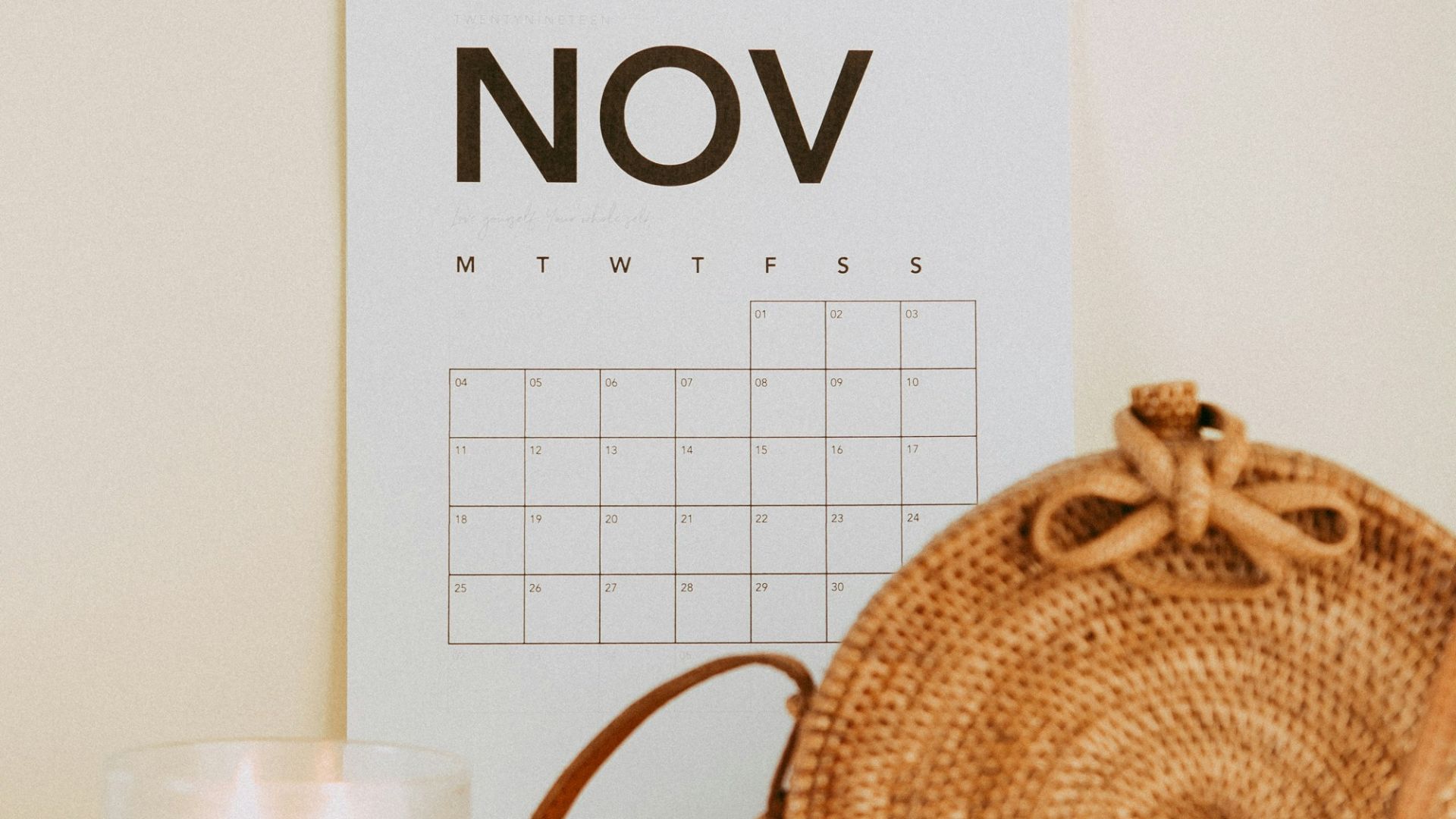 shallow focus photo of calendar mounted on white wall