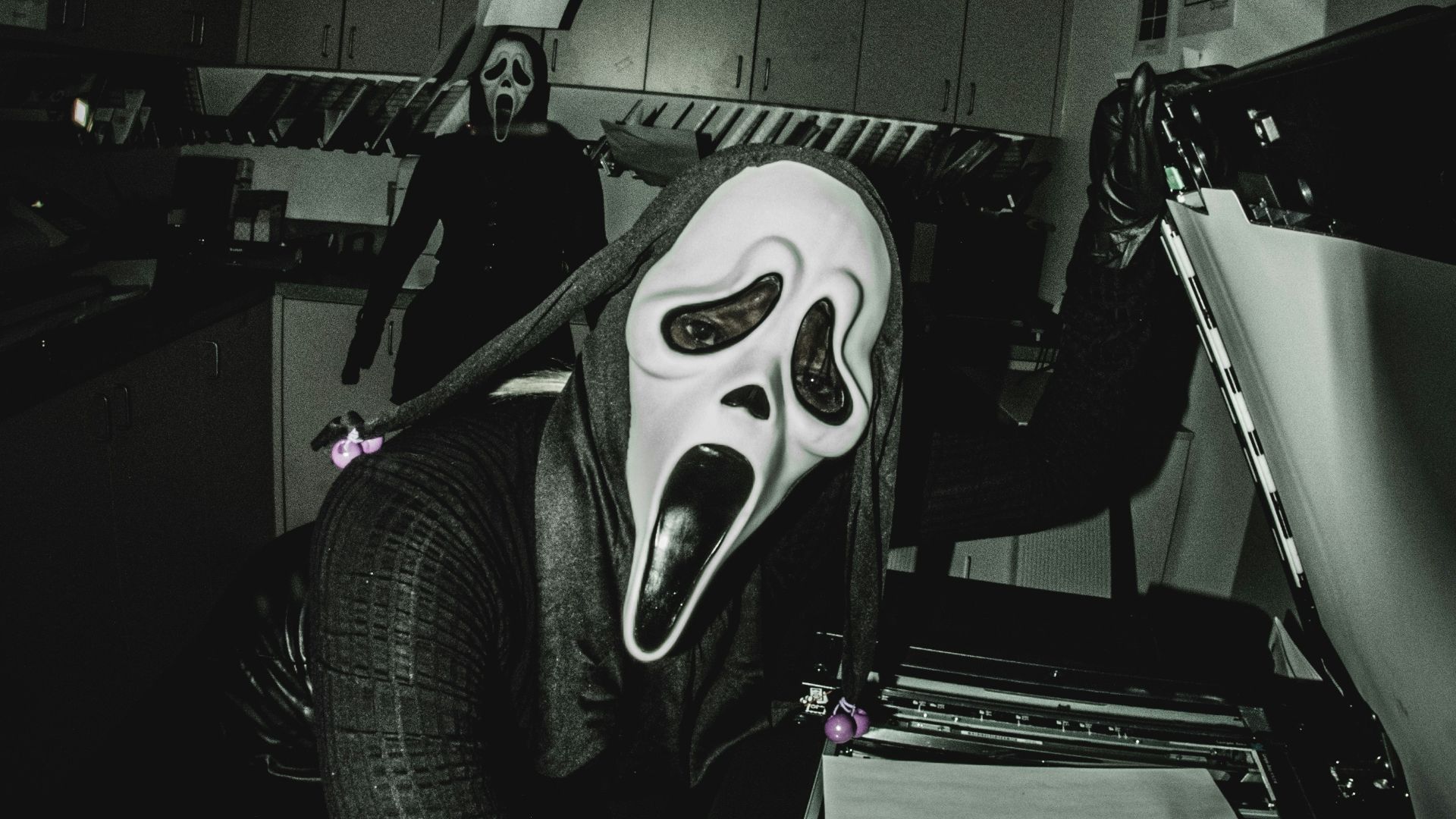 A black and white photo of a person wearing a mask