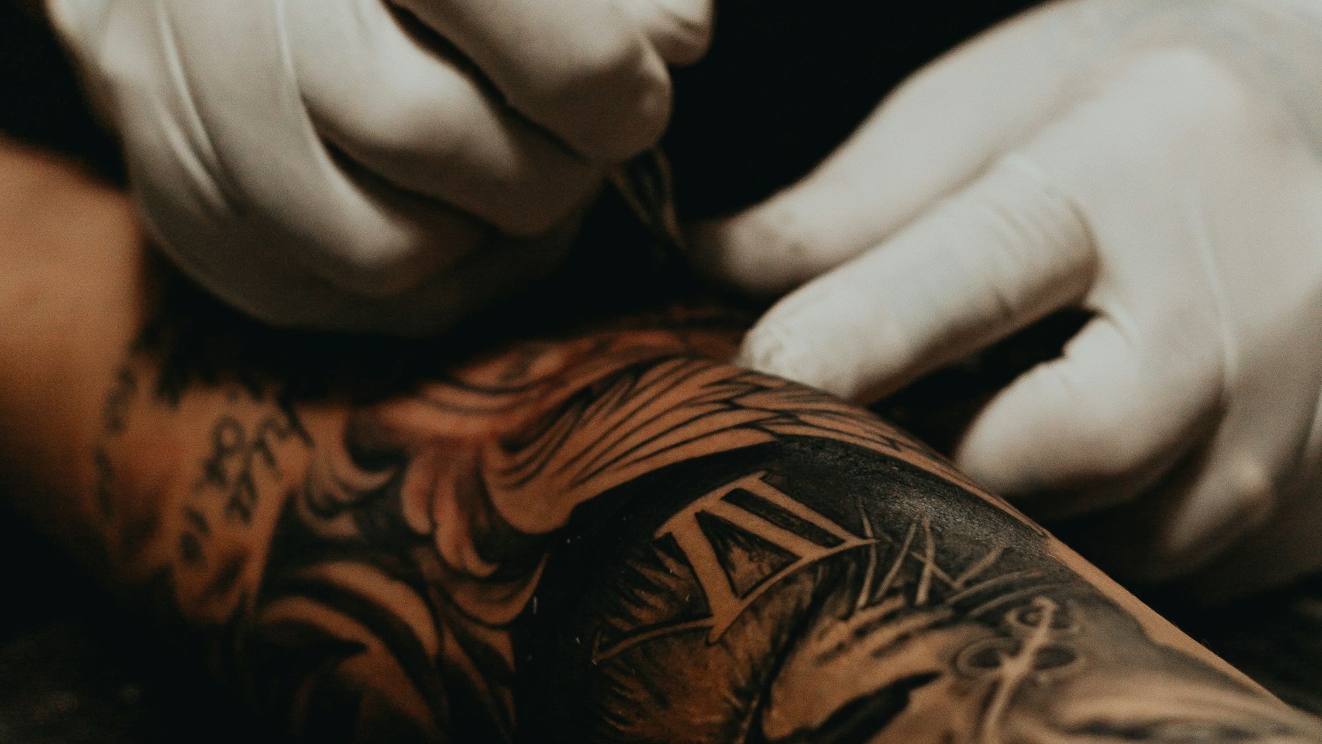 person doing tattoo