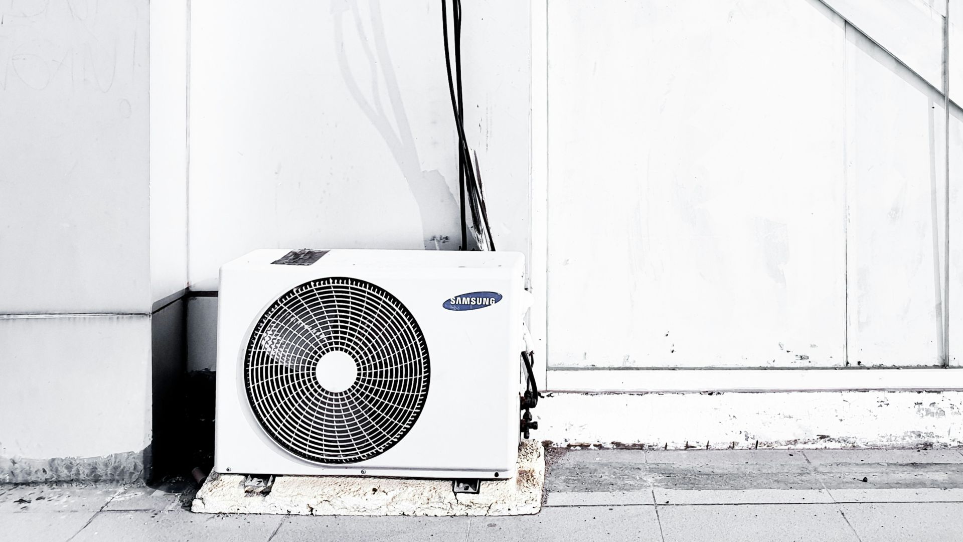 grayscale photography of outdoor AC unit