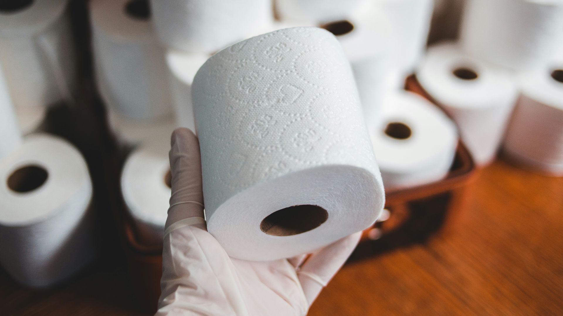 white tissue paper roll on brown wooden table
