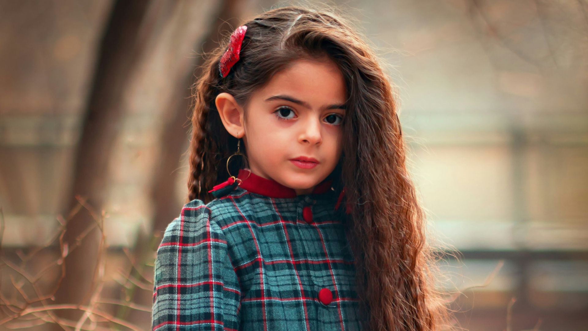 girl standing near tree