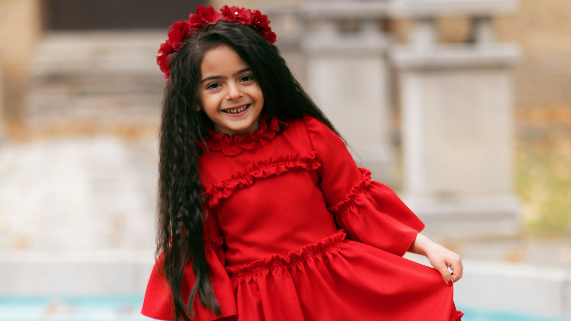 smiling girl holding her dress