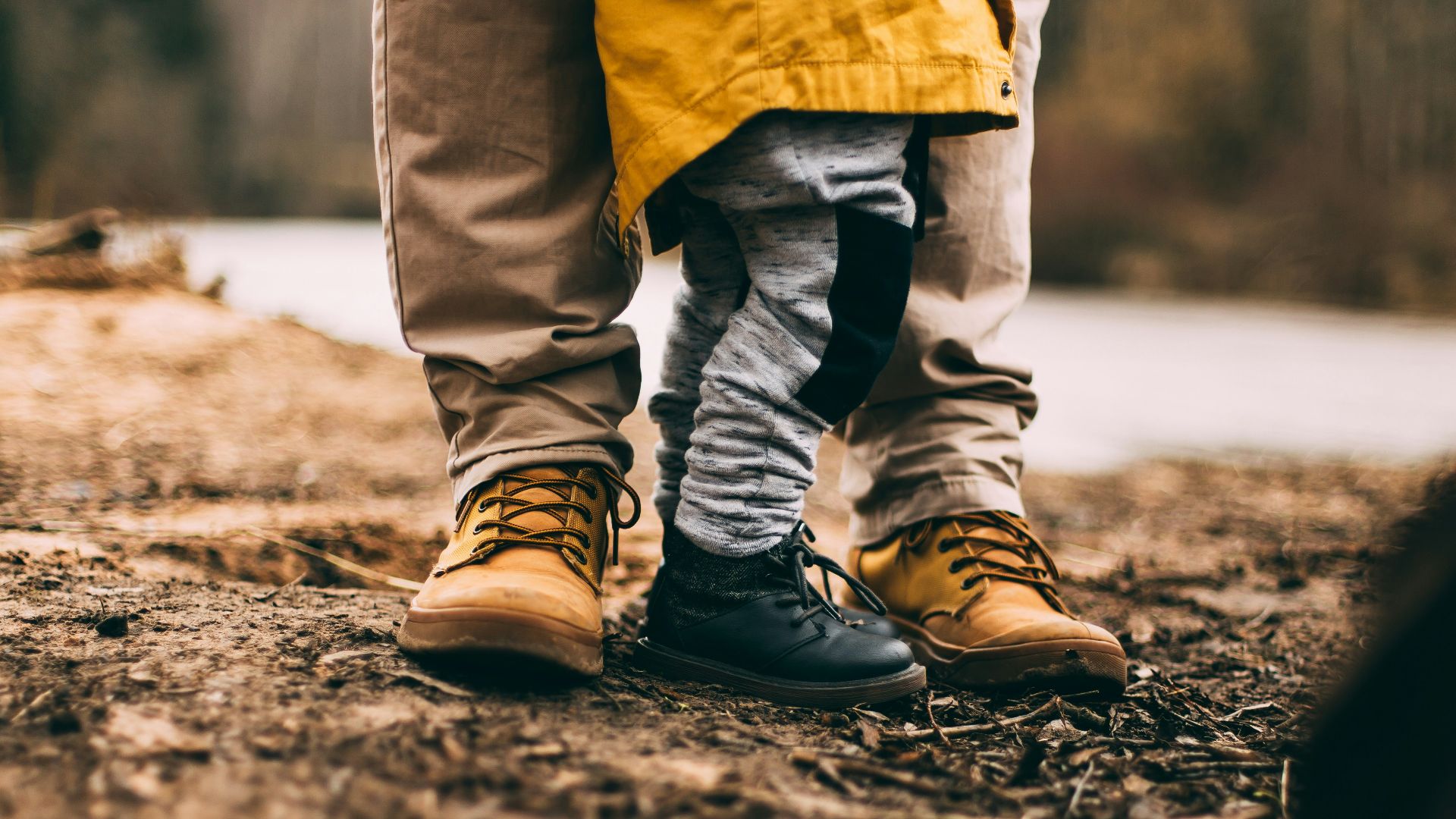 two person step on gray soil