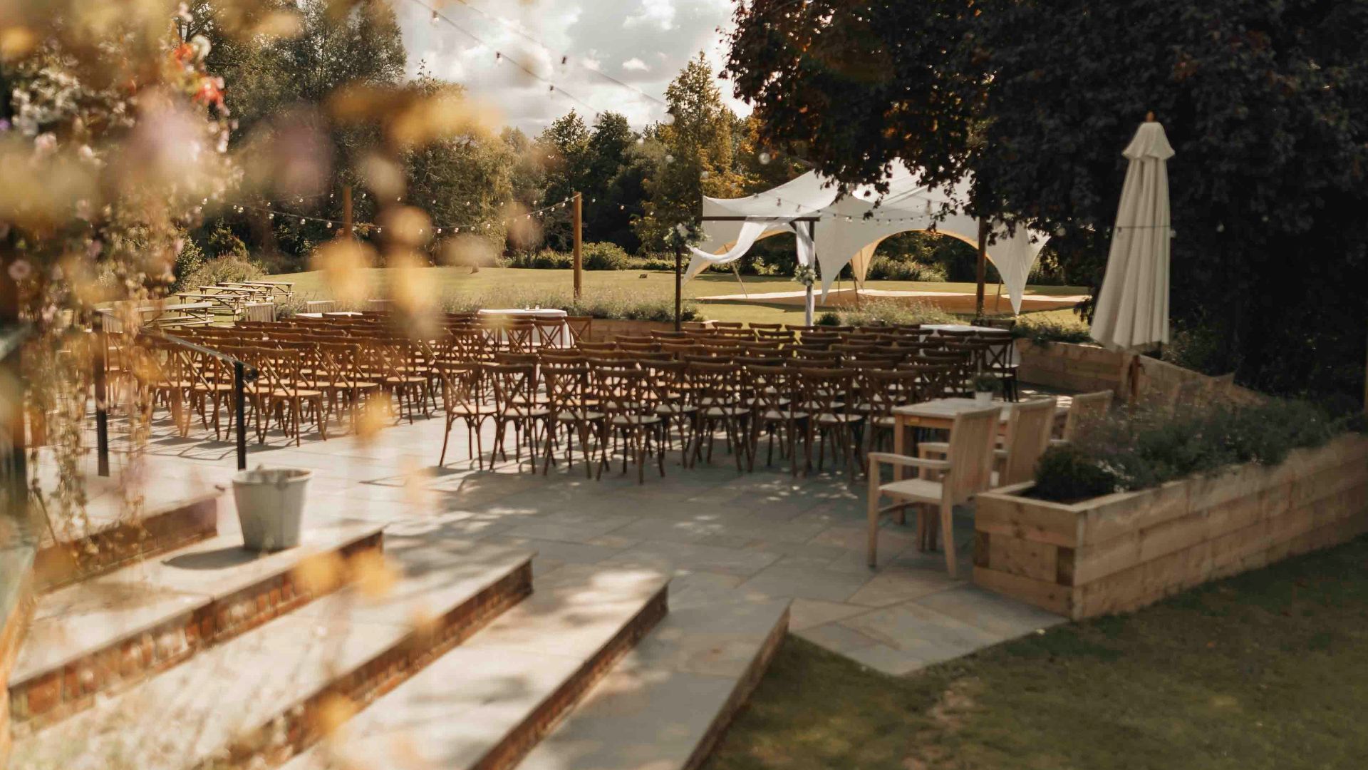 A view of an outdoor wedding venue from a window