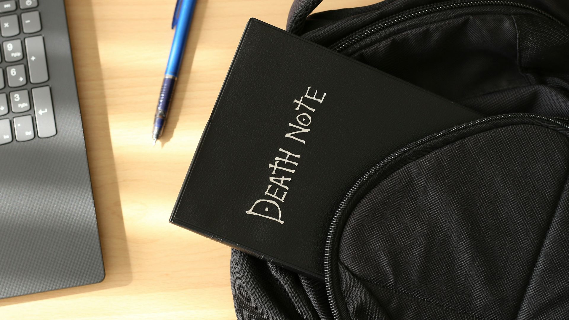 a bag and a laptop on a table