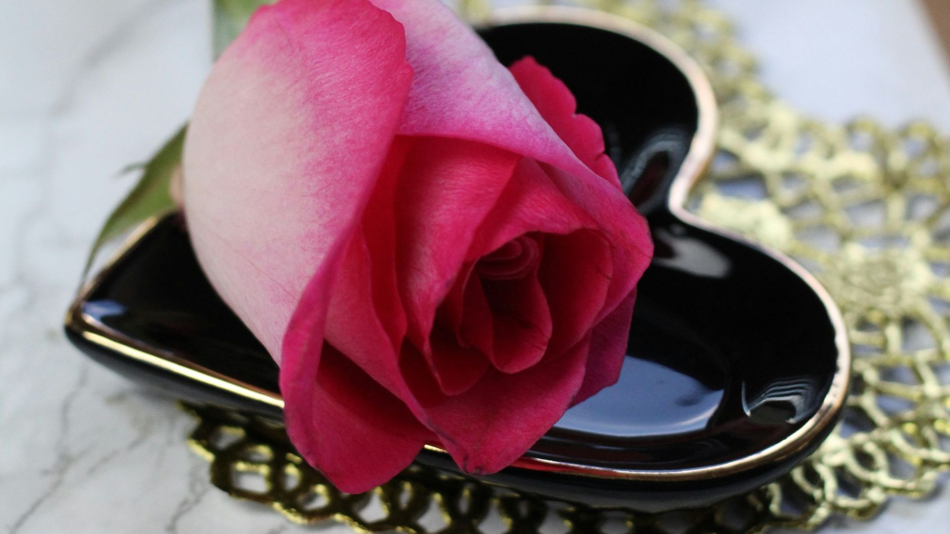 pink rose on gold ring